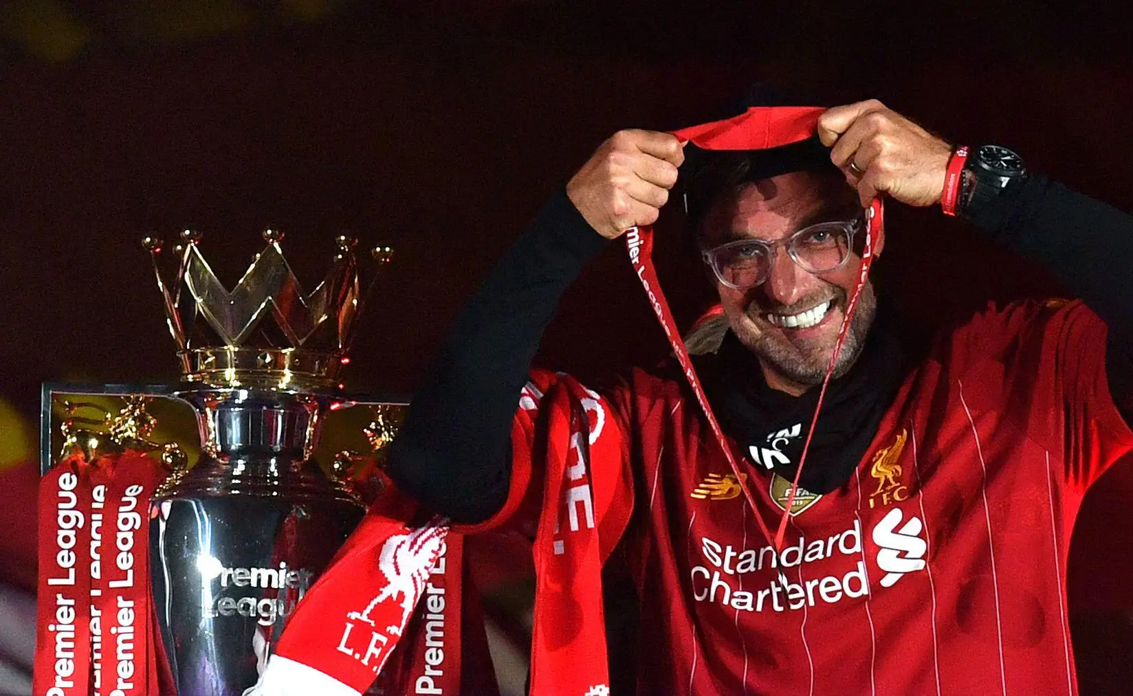 Jurgen Klopp celebrates with the Premier League title. Image: Alamy 