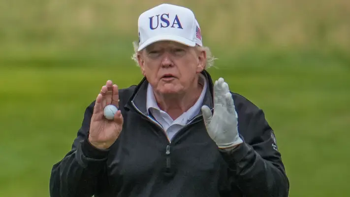 Donald Trump caught 'cheating' at golf on visit to UK as footage of caddie helping US President goes viral