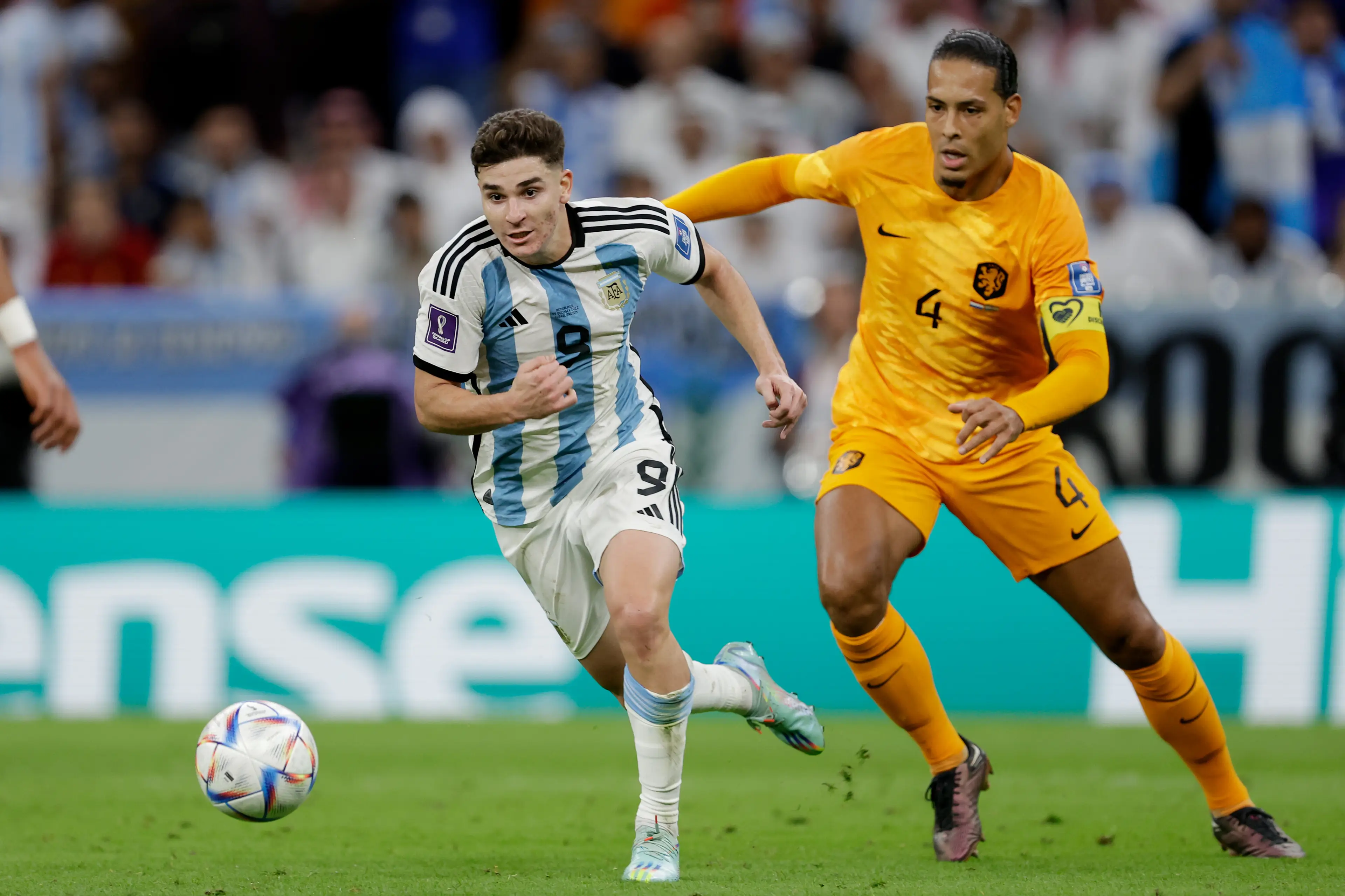 Julian Alvarez and Virgil van Dijk during a World Cup clash. Image: Getty