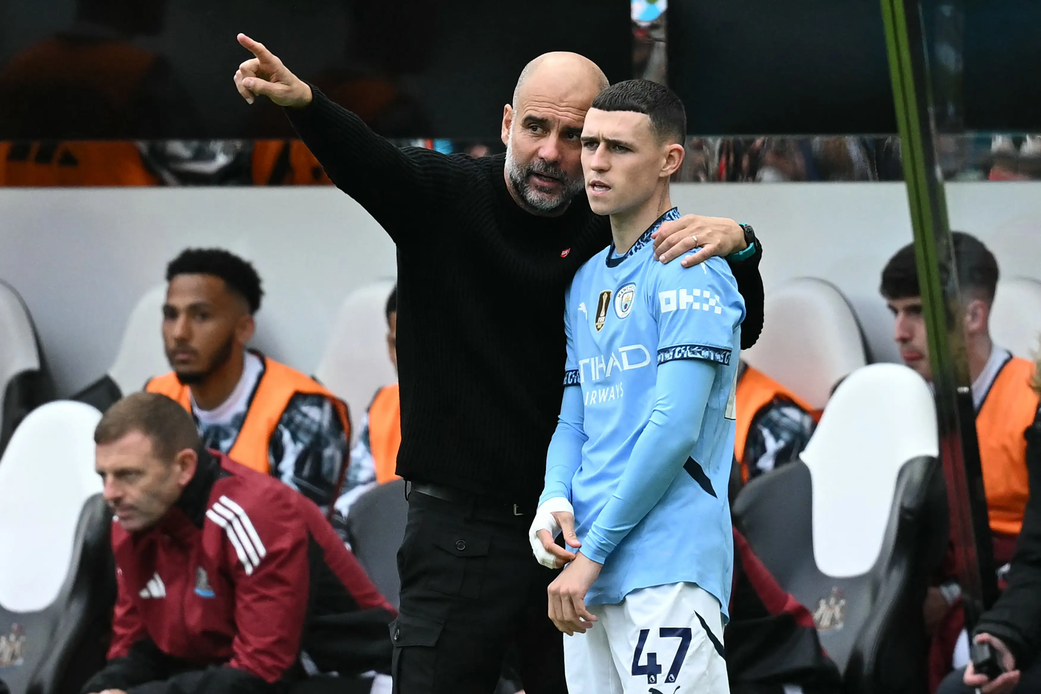 Pep Guardiola instructs Phil Foden before he enters the fray. Image: Getty