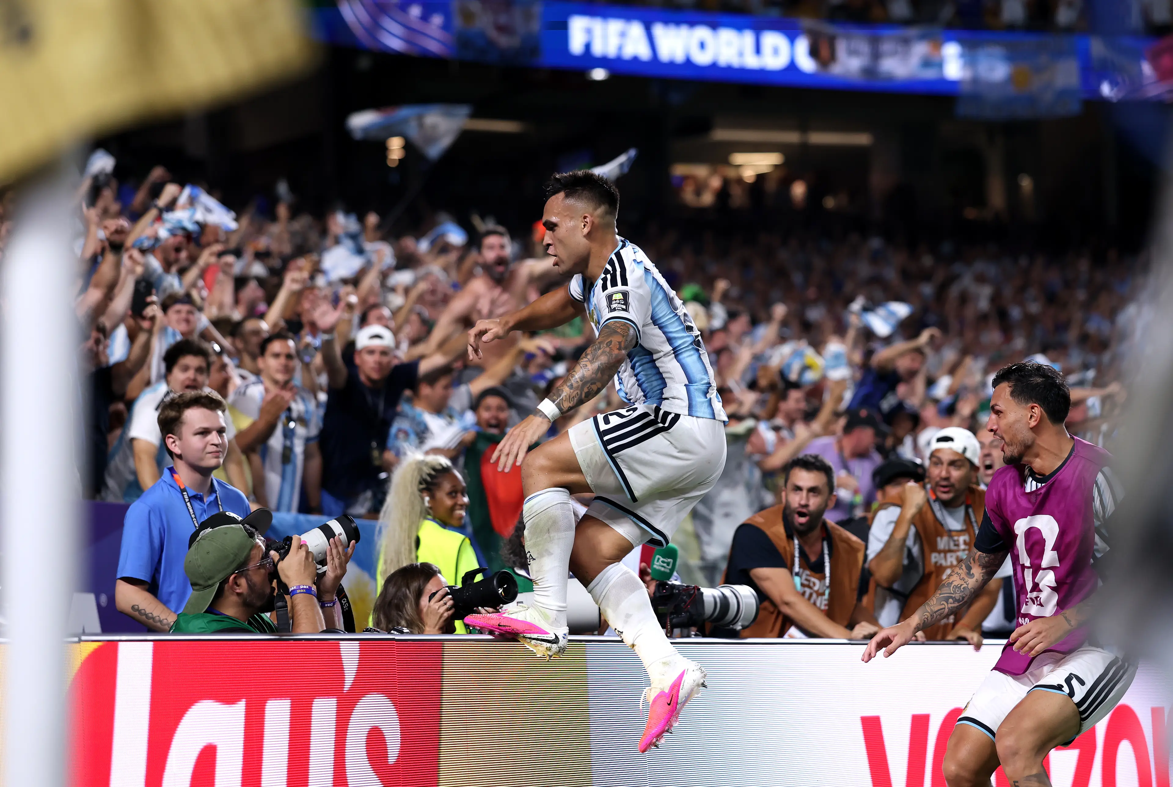 Martinez celebrates by jumping in the crowd. Image credit: Getty
