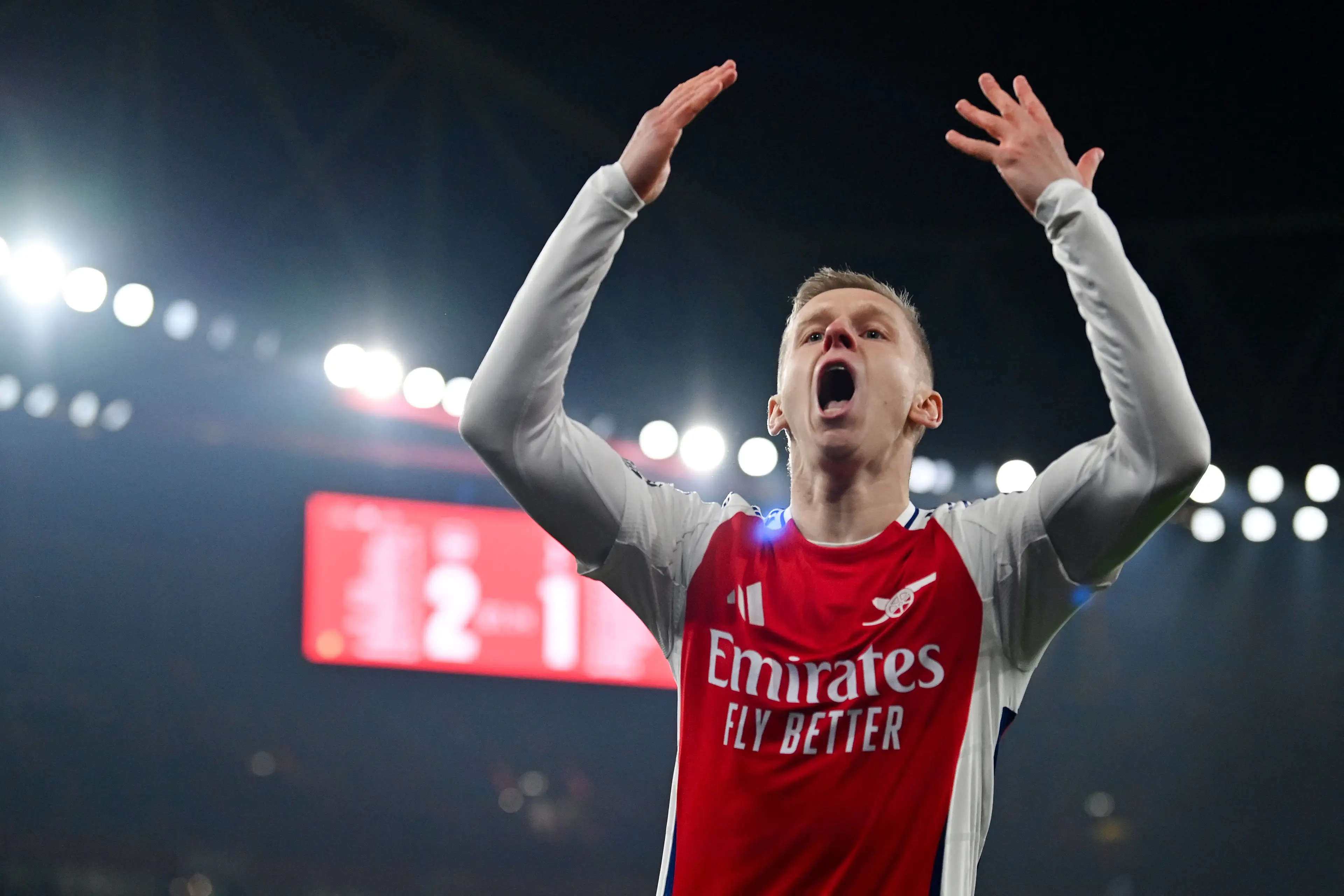Oleksandr Zinchenko gestures to the crowd during Arsenal vs. Tottenham. Image: Getty 