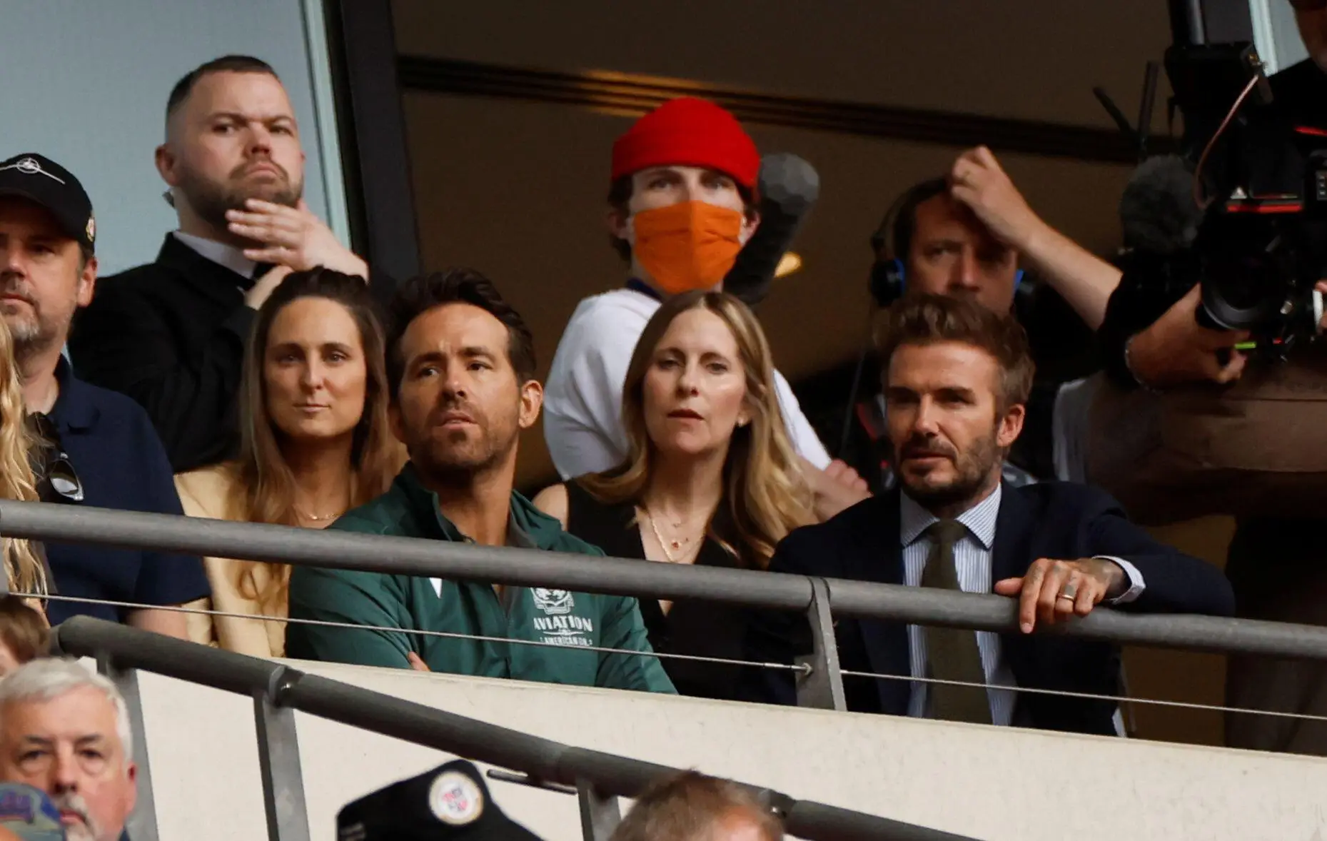 David Beckham sat next to Ryan Reynolds as they watch Wrexham. Image: Alamy