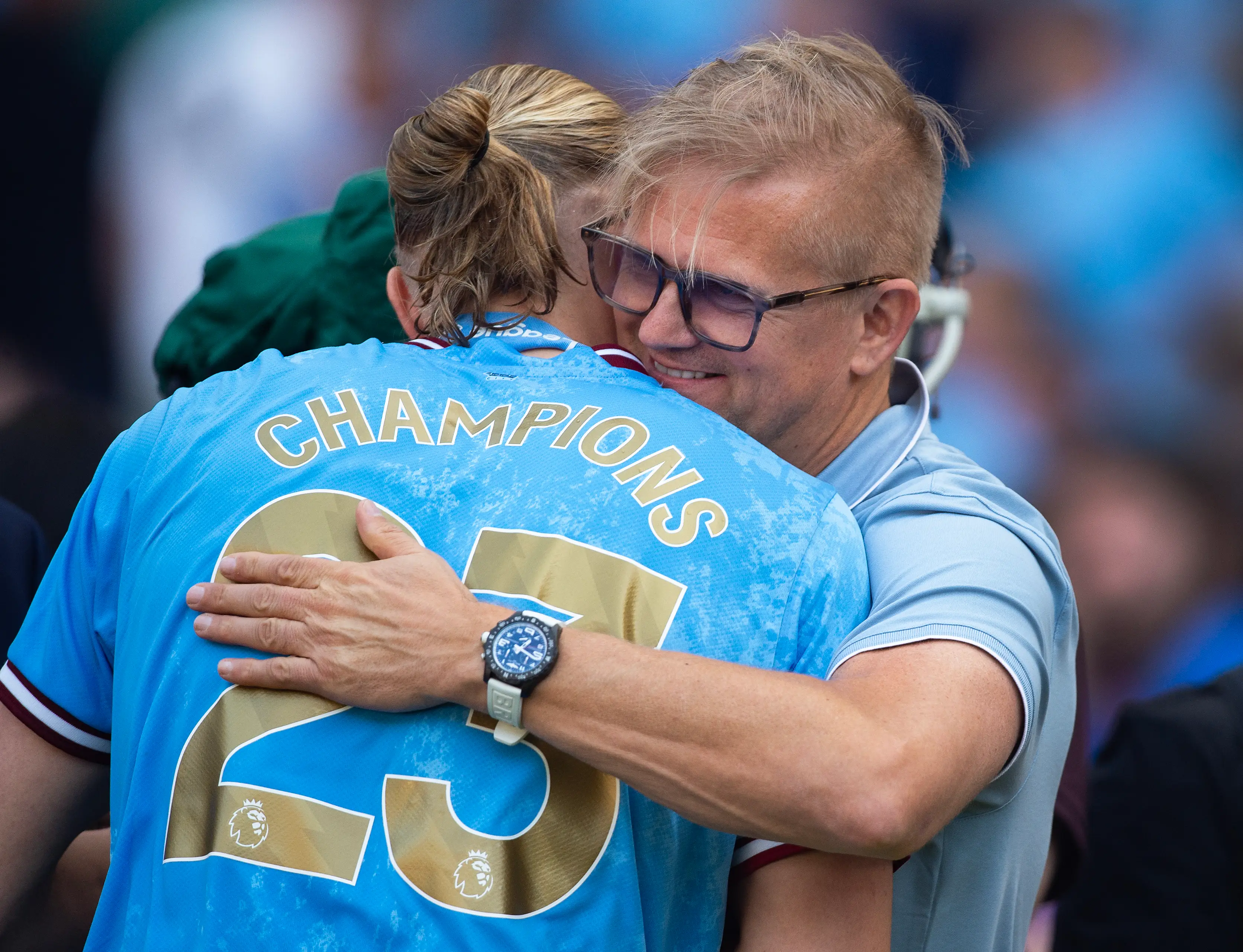 Alfie Haaland shares an embrace with his son Erling after Manchester City's Premier League triumph last season. Image: Getty