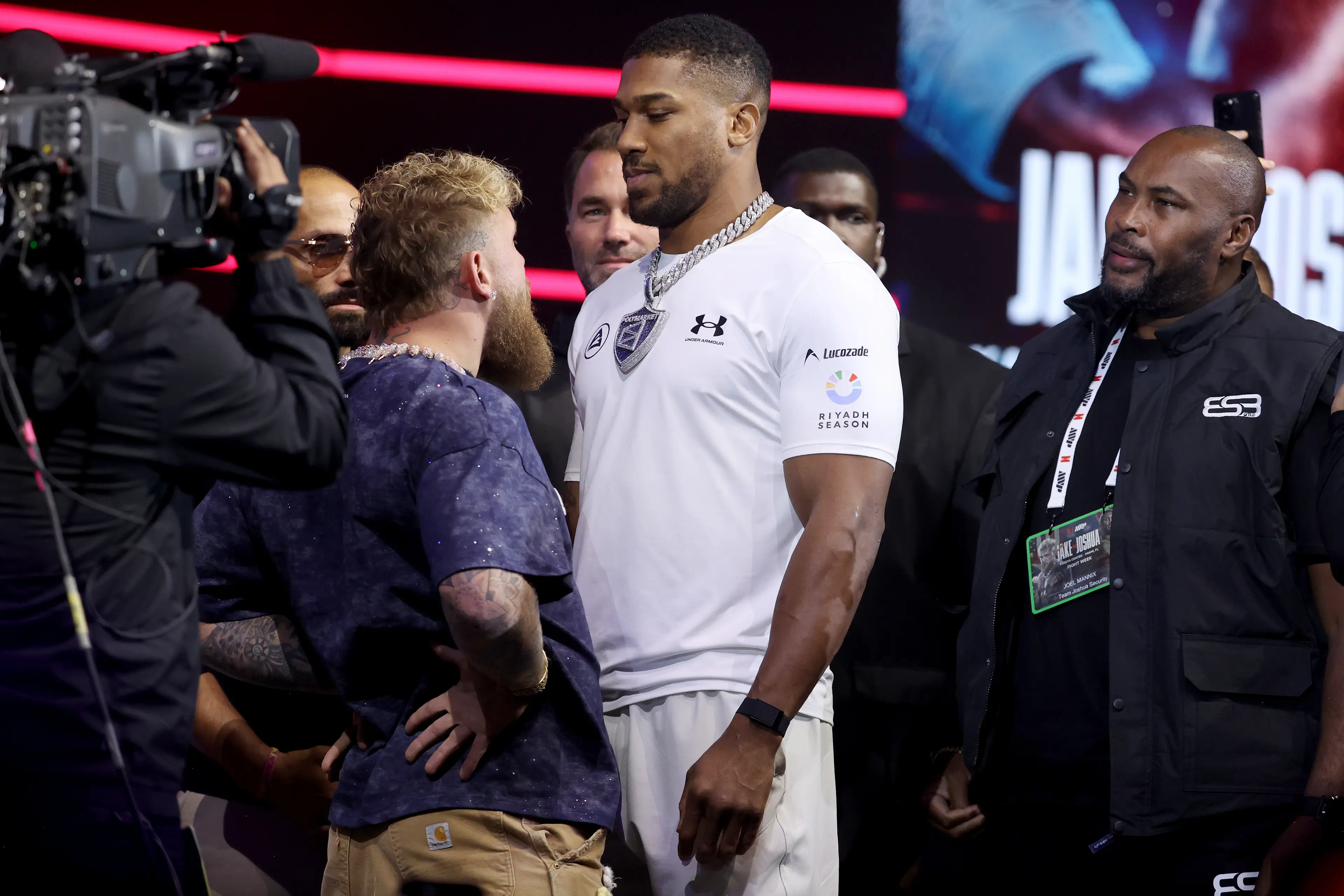Jake Paul and Anthony Joshua facing off at the press conference (Image: Getty)