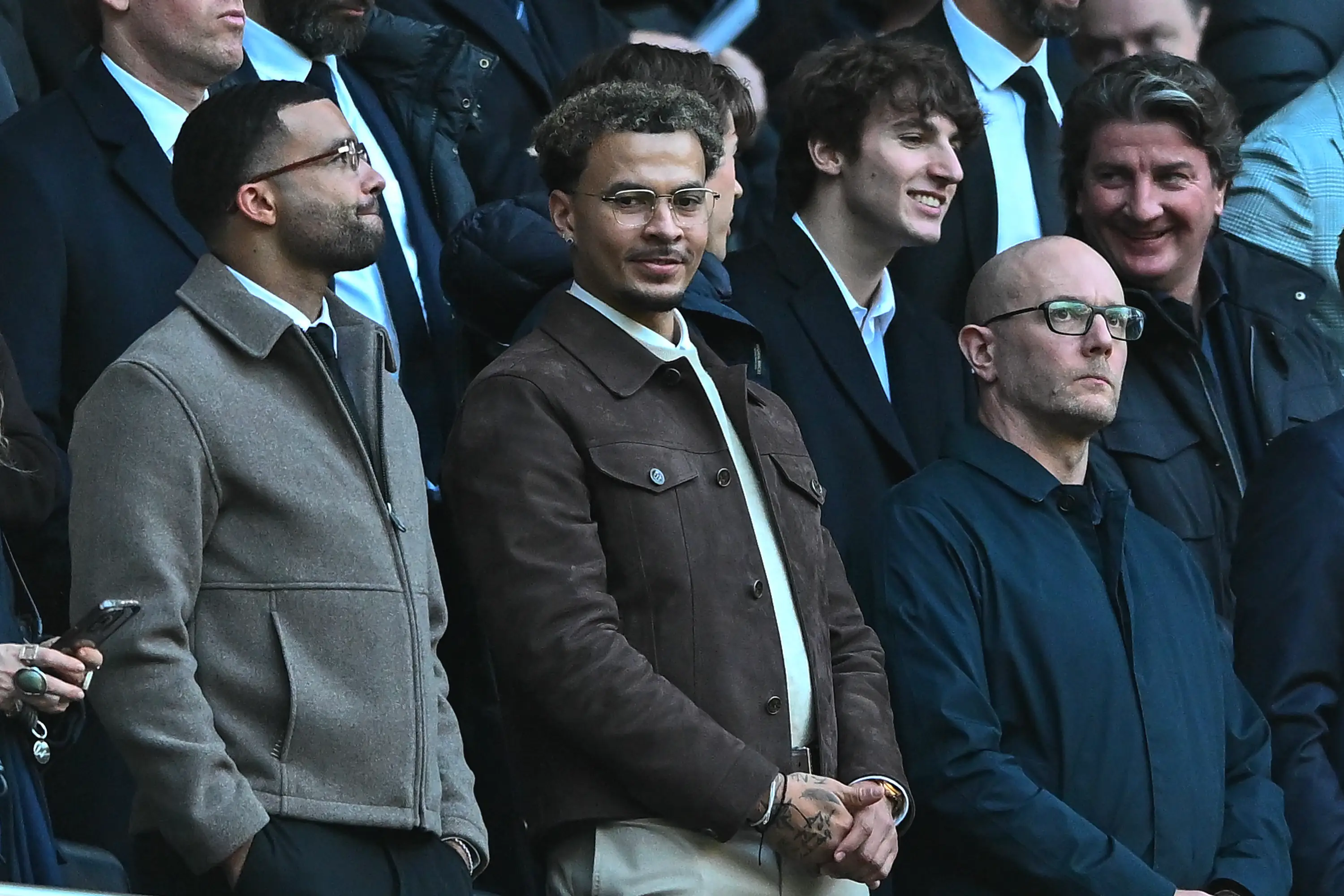 Dele Alli pictured in the stands during Tottenham's clash against Arsenal in February. Image credit: Getty