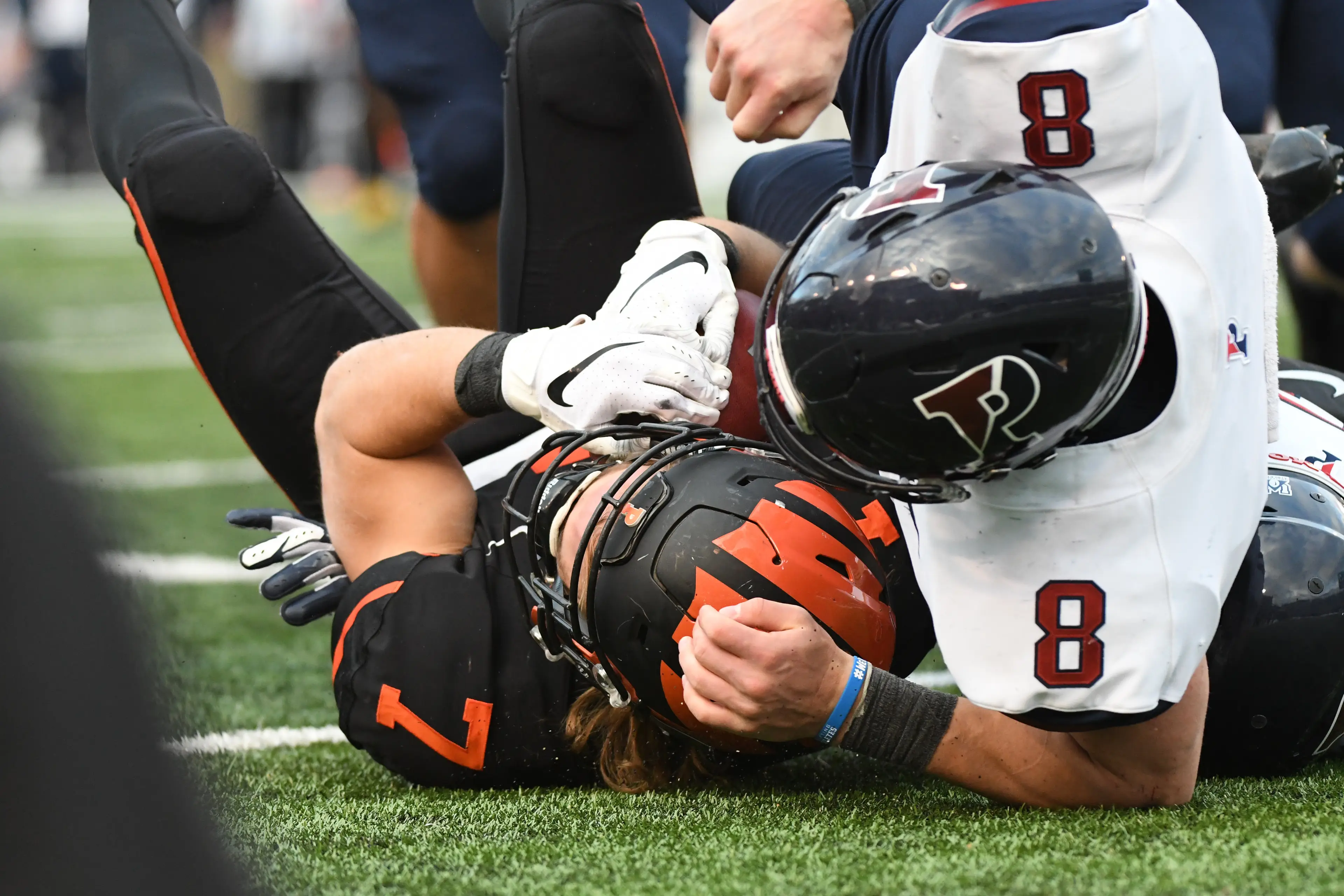 Princeton Tigers wide receiver Tiger Bech (7) is tackled by Pennsylvania Quakers running back Hunter Hayes (8) (Getty Images)
