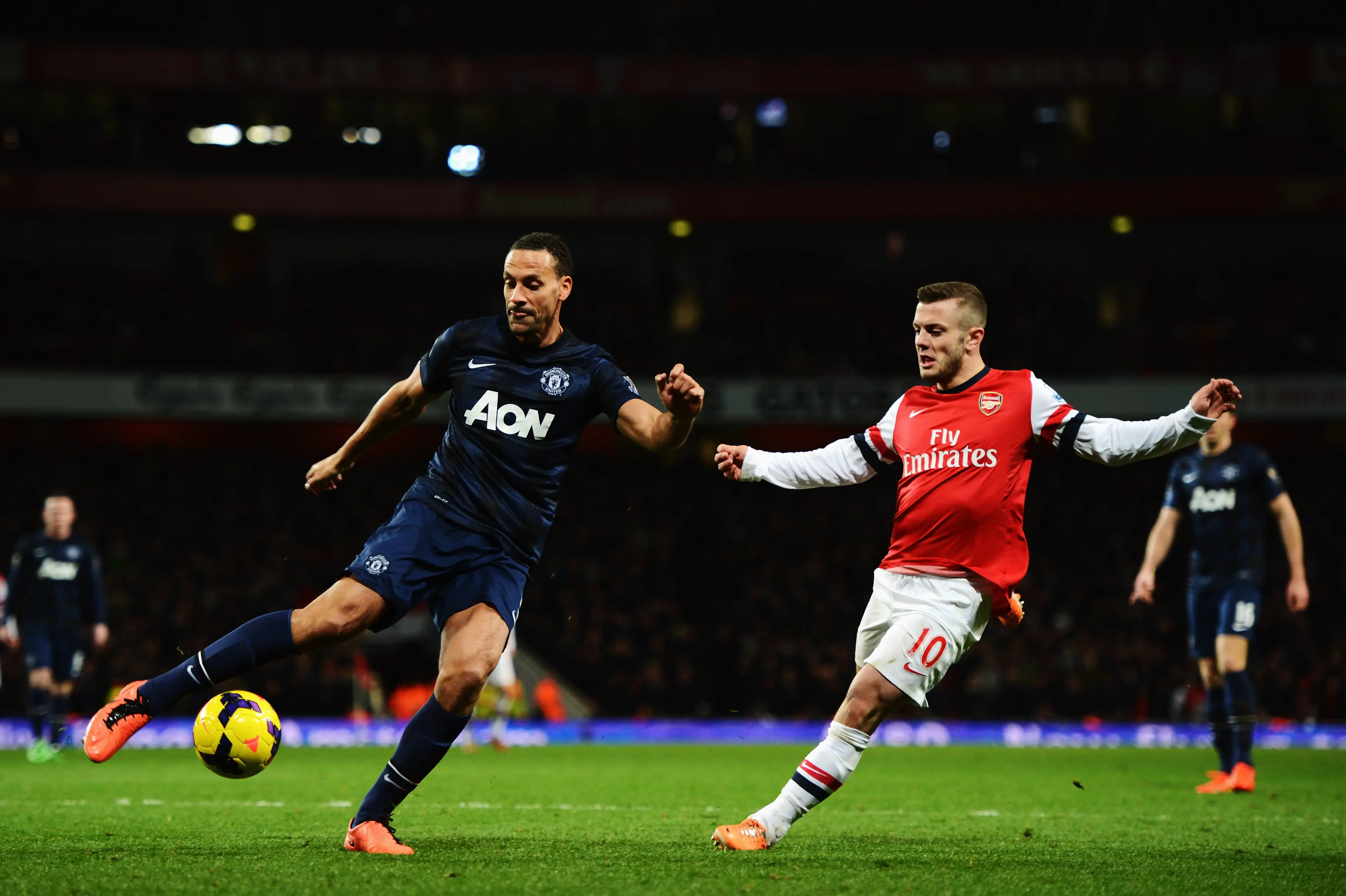 Rio Ferdinand and Jack Wilshere during a Premier League clash. Image: Getty