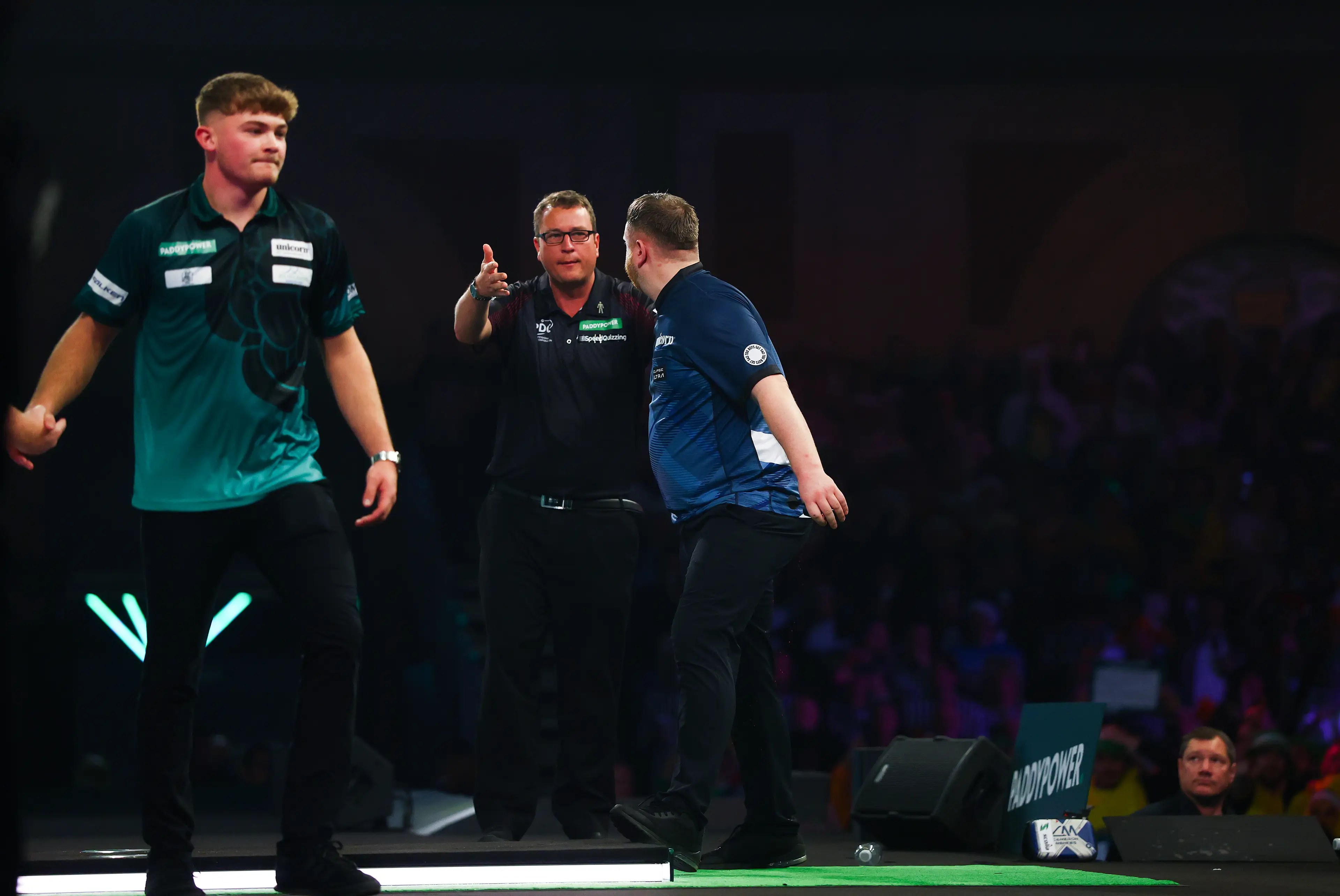 Cameron Menzies is told to get off the stage by referee Kirk Bevins. Image: Getty 