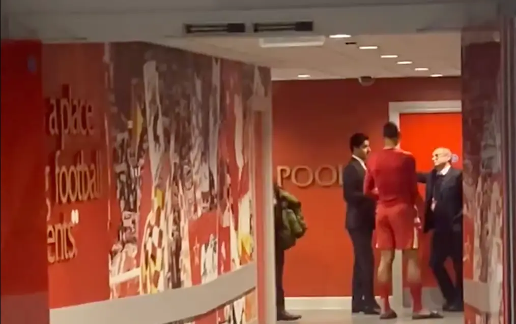 Van Dijk talking to Luis Campos (right) and Nasser Al-Khelaifi (left) in the Anfield tunnel (Image: Twitter/@CasseJosue)