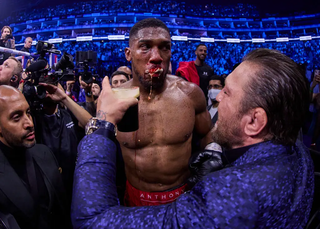 Conor McGregor famously entered the ring to offer Anthony Joshua some forged Irish stout after his win over Robert Helenius. (Image: Getty)