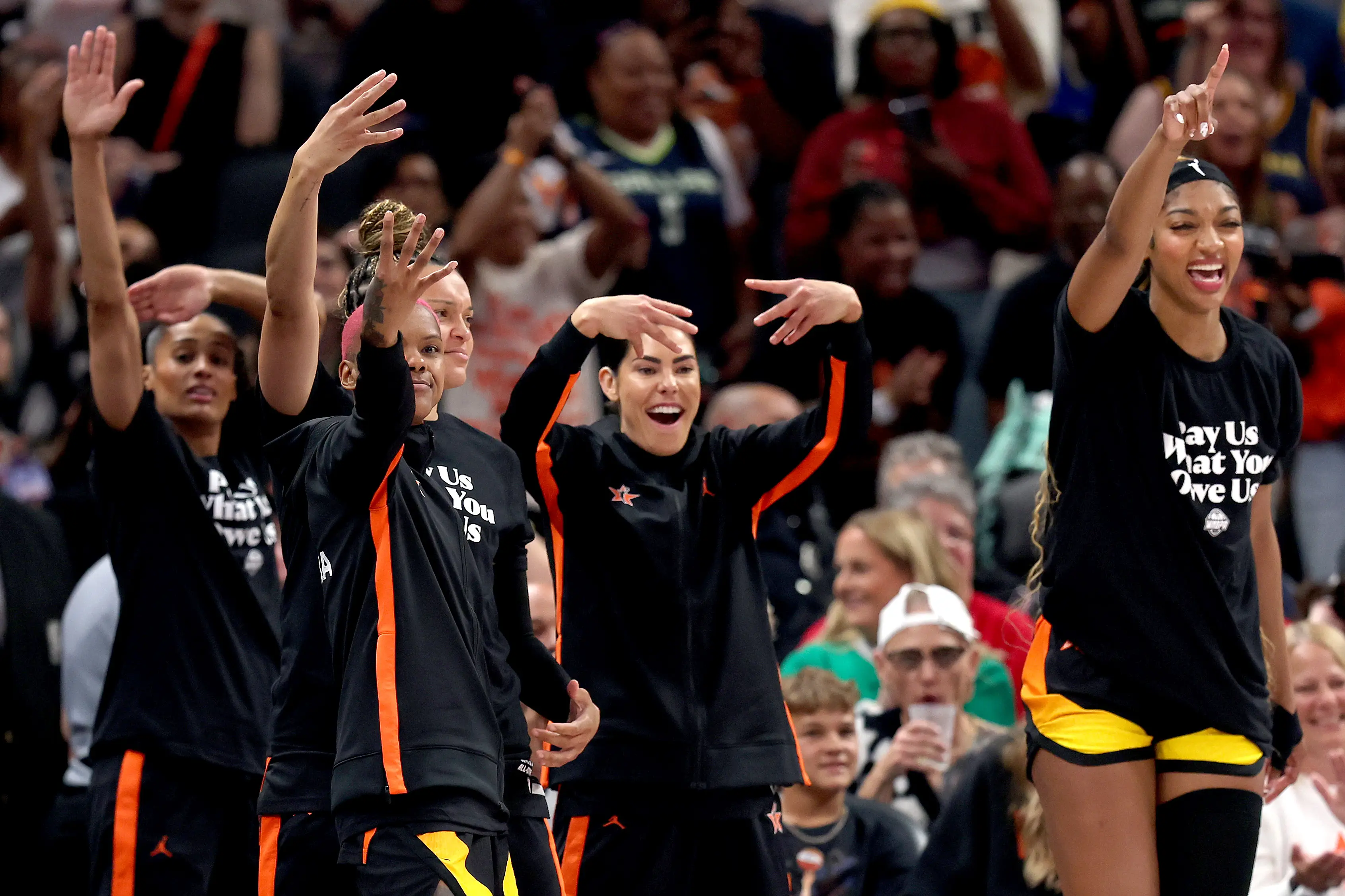 Angel Reese (right) joined a protest recently advocating for fairer pay. (Image: Getty)