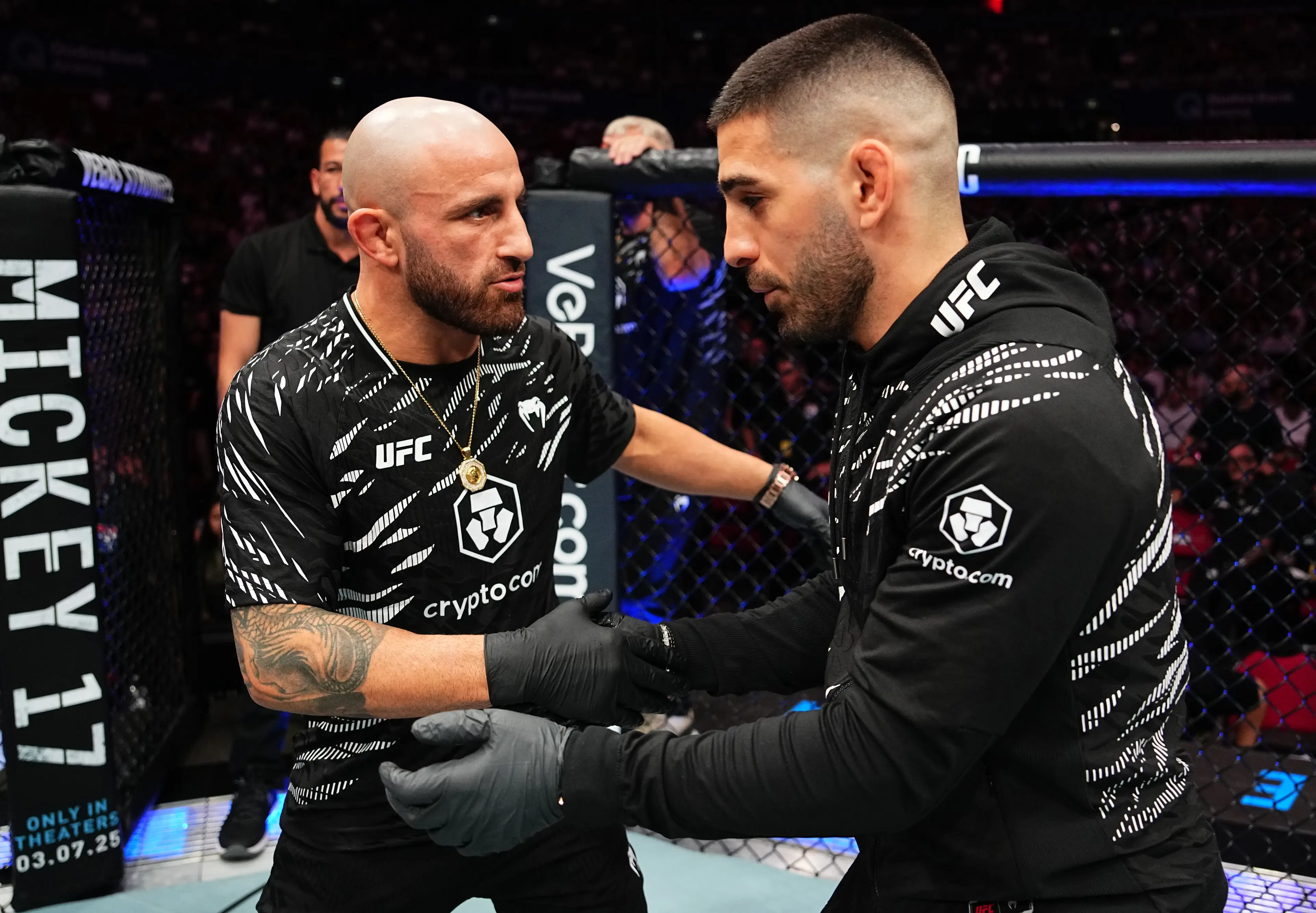 Alexander Volkanovski and Ilia Topuria embrace at UFC 312. Image: Getty 