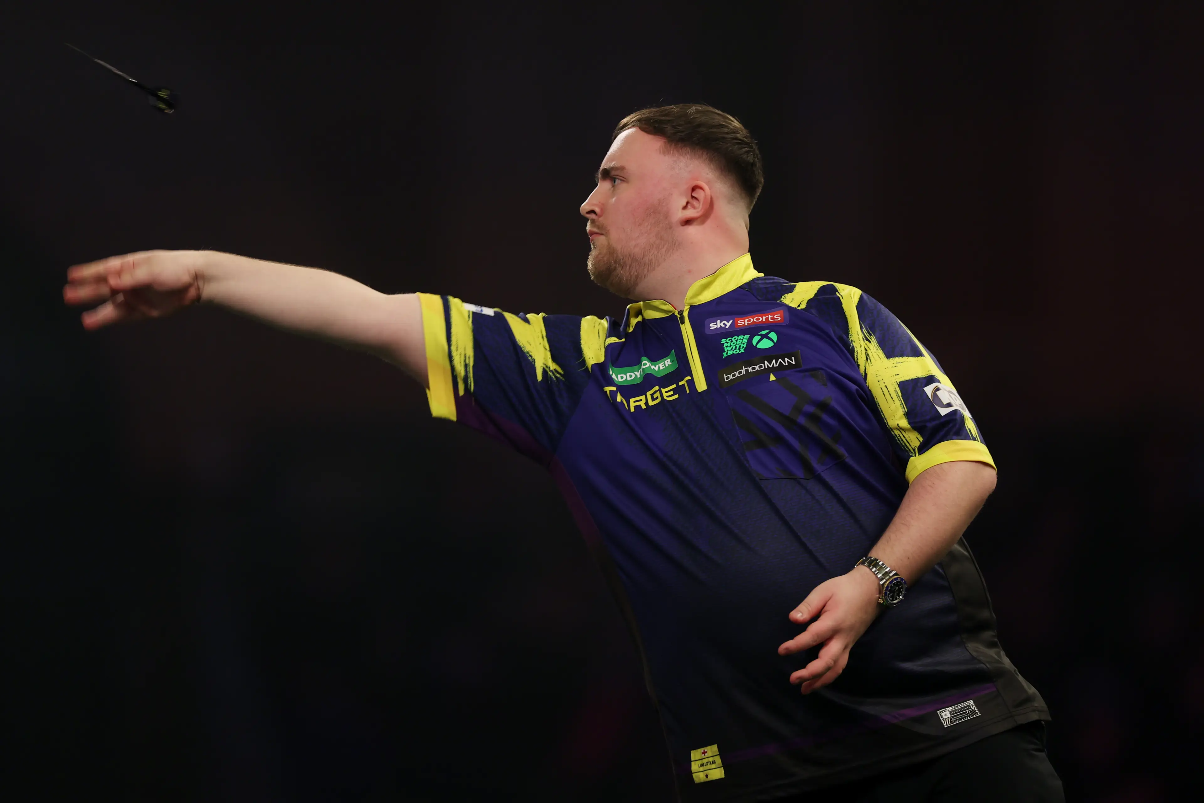 Luke Littler in action against Ryan Searle at the World Darts Championship. Image: Getty 