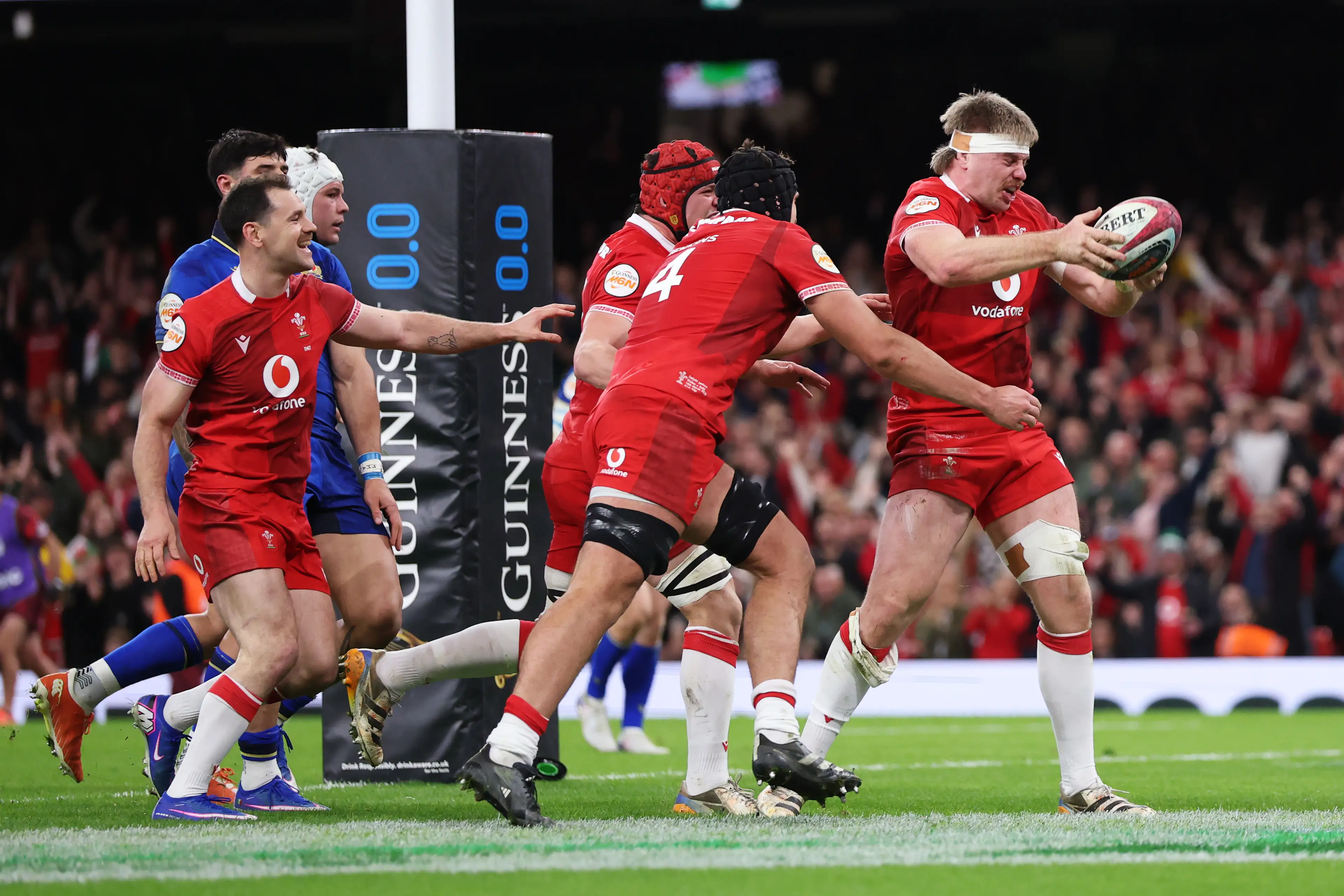 Aaron Wainwright of Wales celebrates scoring his team's first try with teammates during the Guinness Six Nations 2026 match between Wales and Italy (Getty Images)