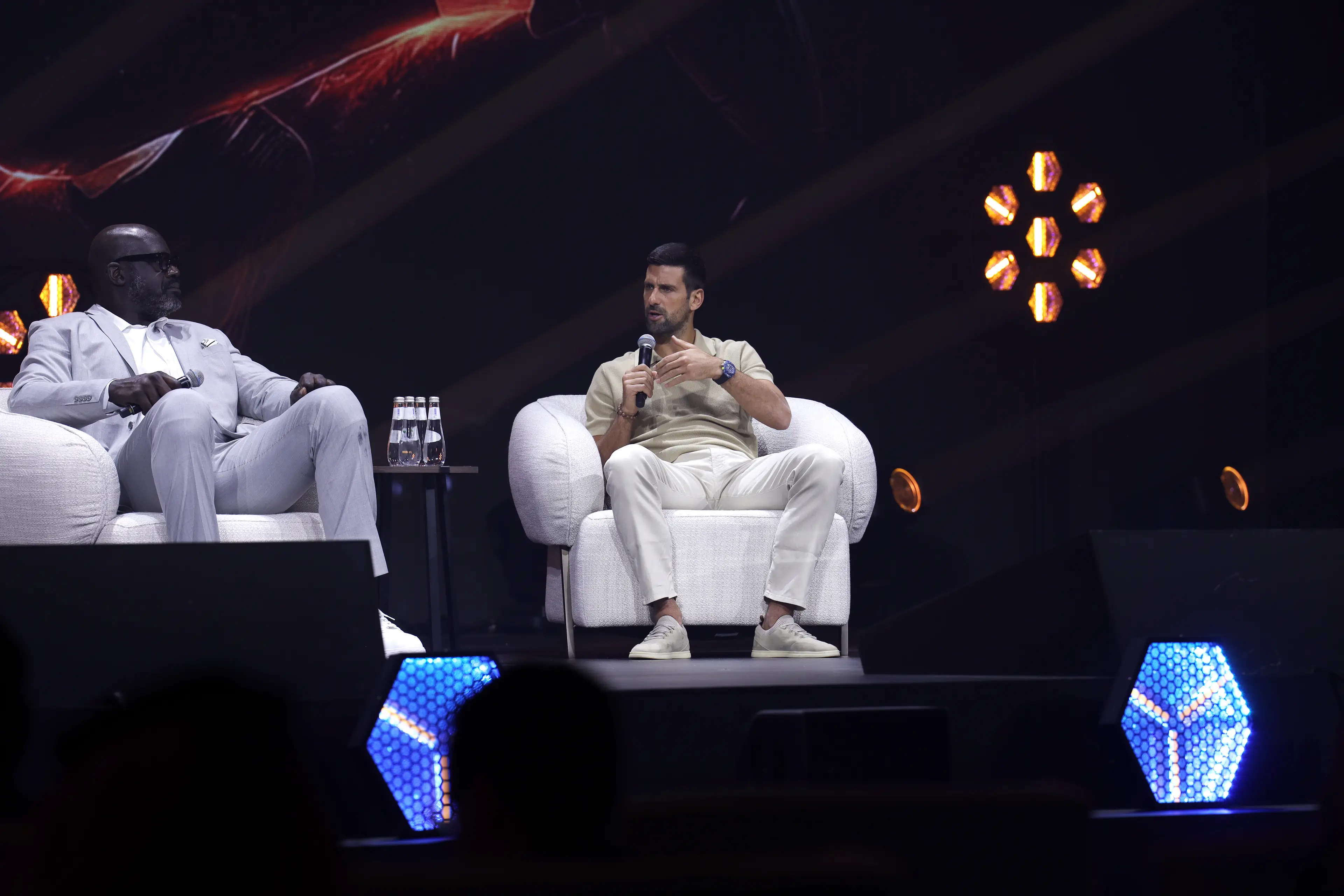 Shaquille O’Neal sat next to Novak Djokovic. Image: Wed Al Shehri / Stringer via Getty