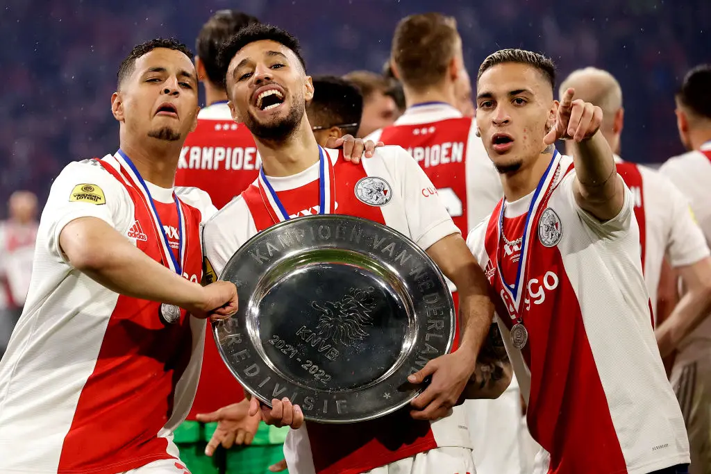 Noussair Mazraoui (centre) and Antony (right) celebrate after Ajax win the Eredivisie title -