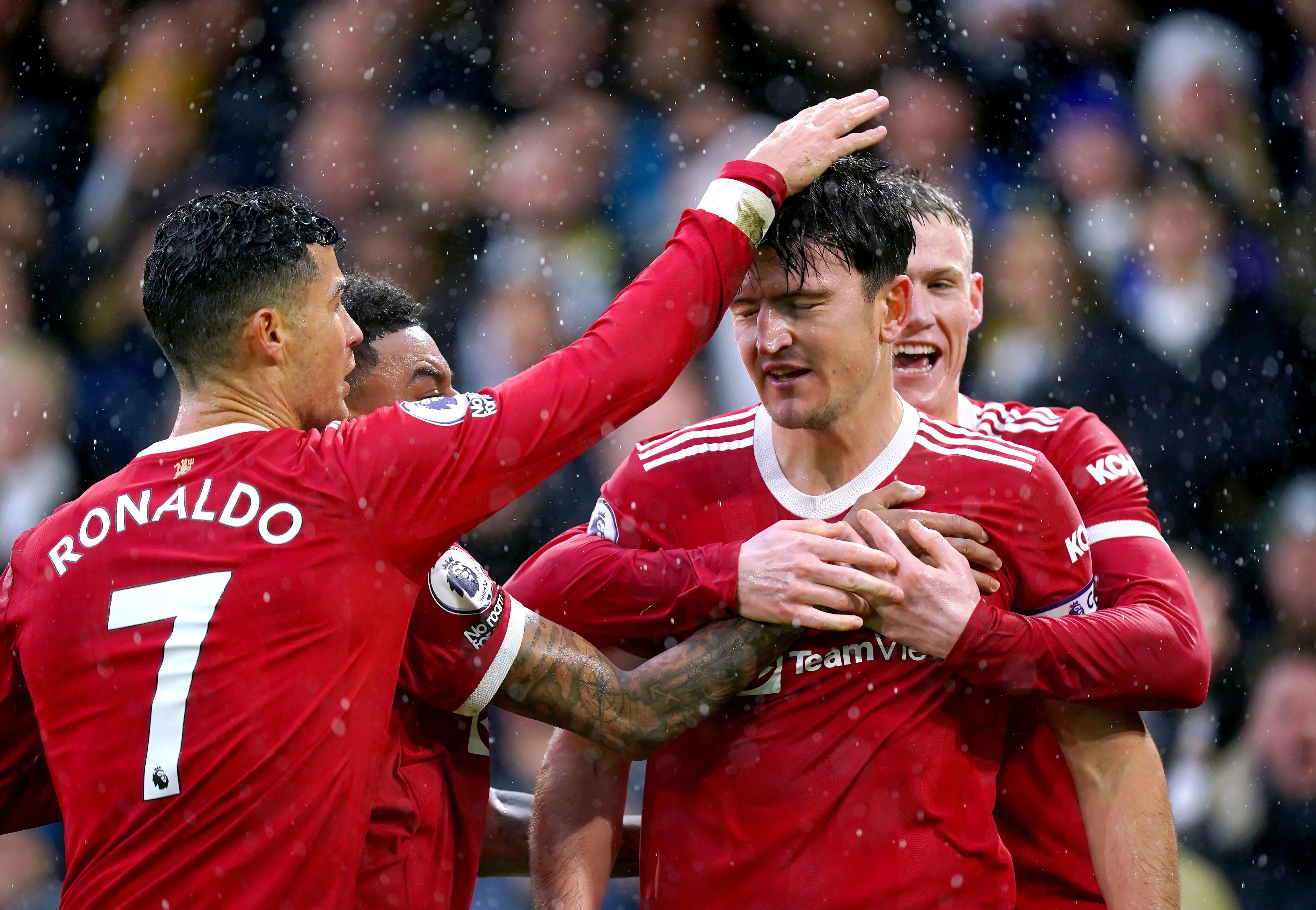 Maguire and his captaincy rival celebrate the goal. Image: PA Images