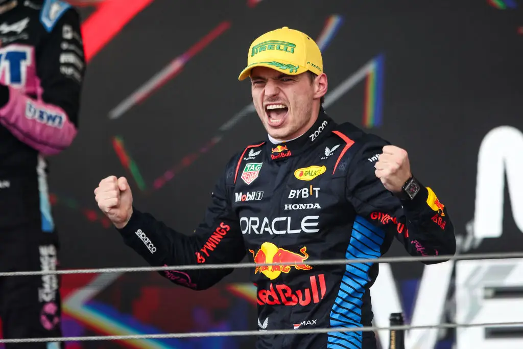 Max Verstappen celebrates on the podium after winning the 2024 Brazilian GP (Image: Getty)