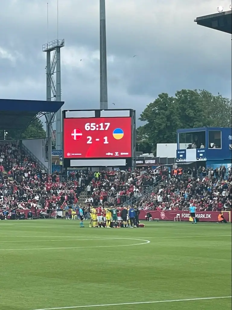 Players huddled around Eriksen while he was receiving treatment. Image credit: X