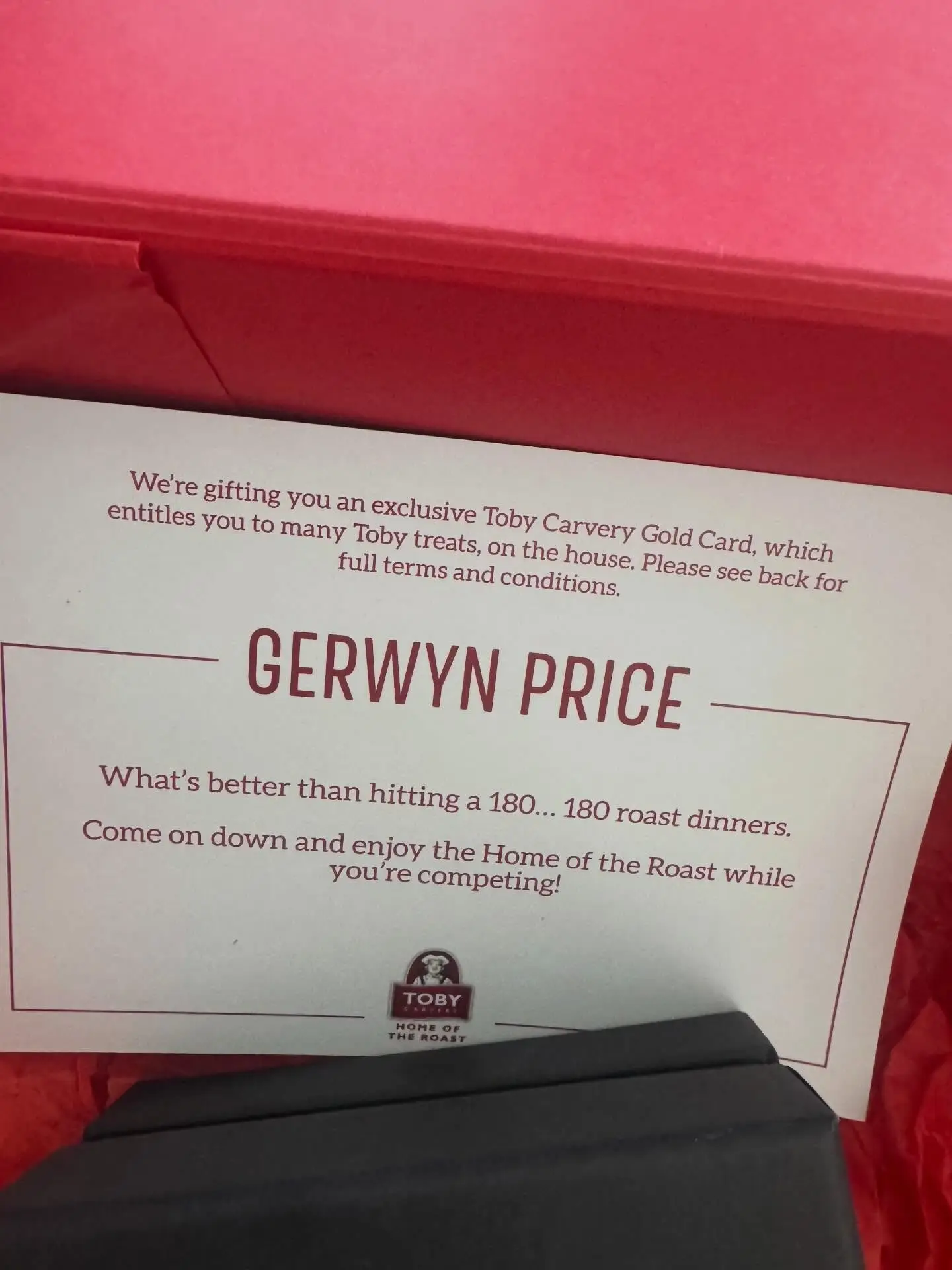 Price is understandably delighted with his gift from Toby Carvery. Image credit: Facebook/Gerwyn Price