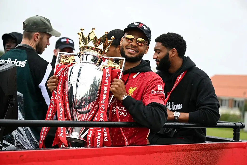 Cody Gakpo celebrated winning the Premier League title with Liverpool during the club's official parade. (Image: Getty)