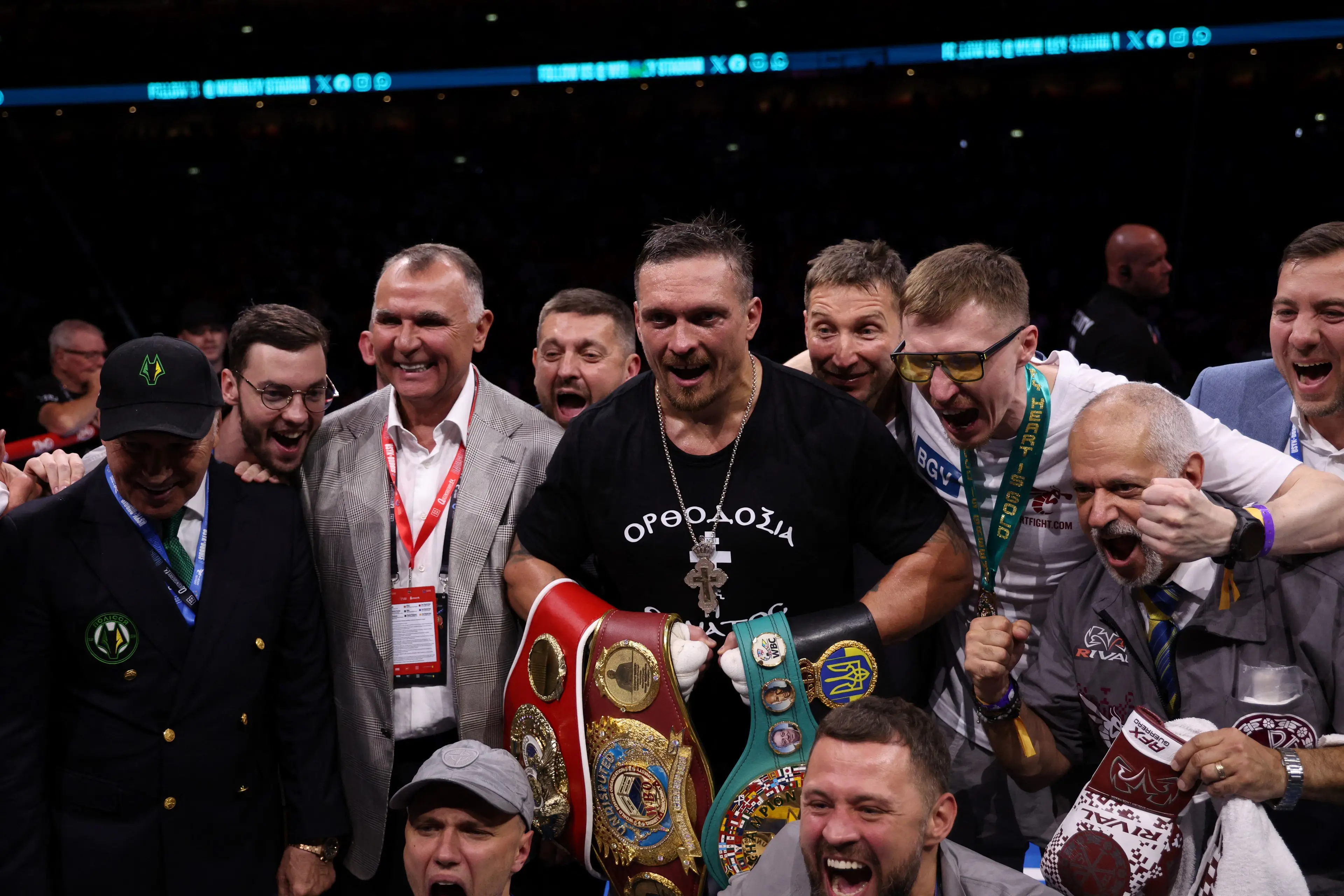 Oleksandr Usyk celebrates after beating Daniel Dubois to win the WBC title. (Image: Getty)