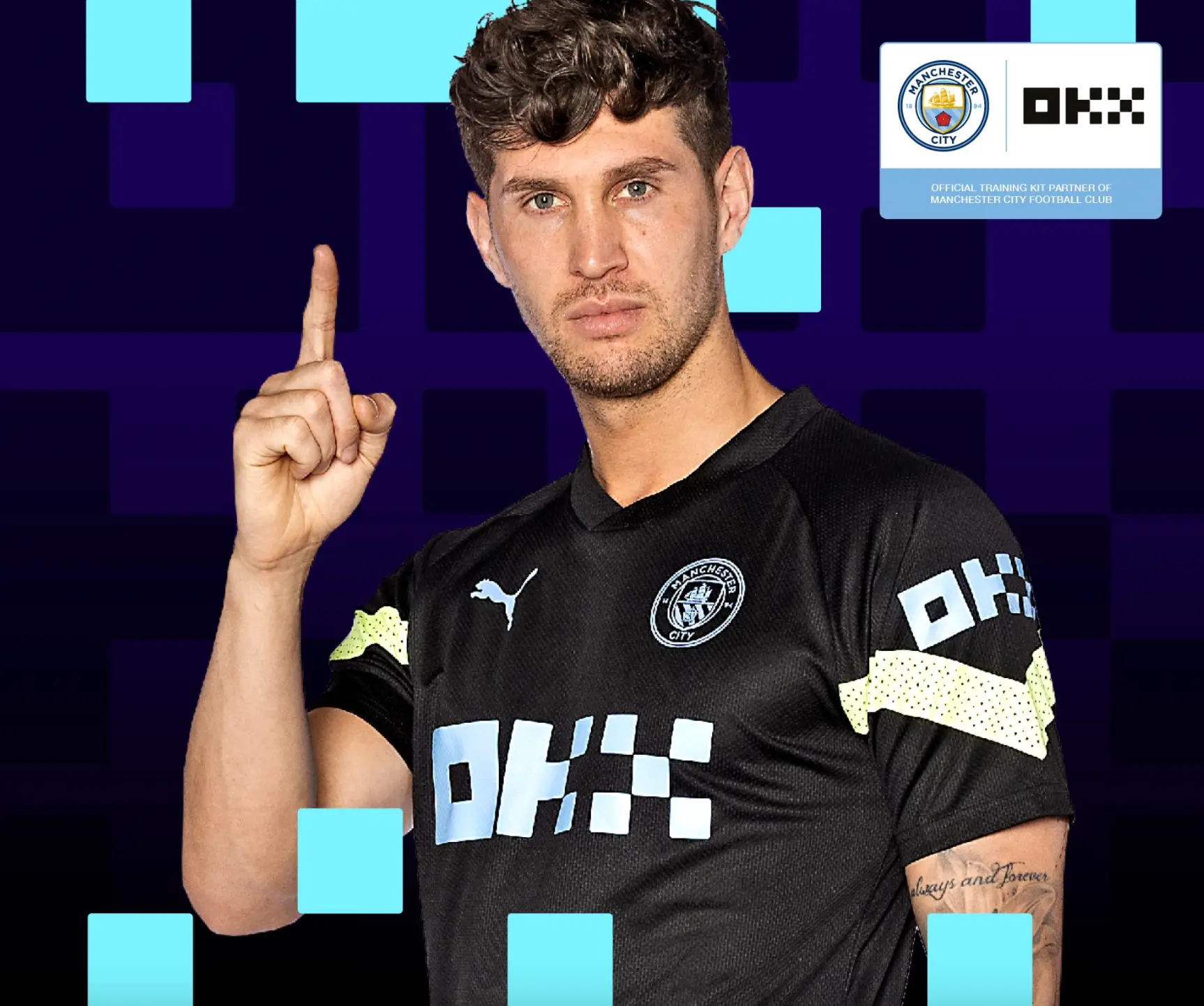 John Stones in OKX branded Manchester City training wear. ManCity.com