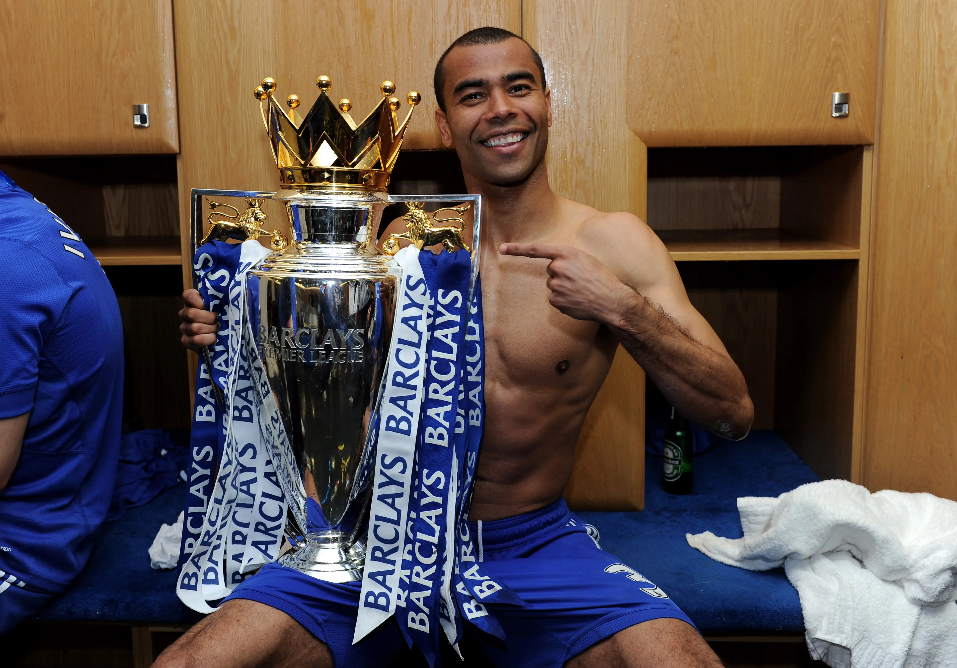 Ashley Cole poses with the Premier League trophy in 2010. Image credit: Getty