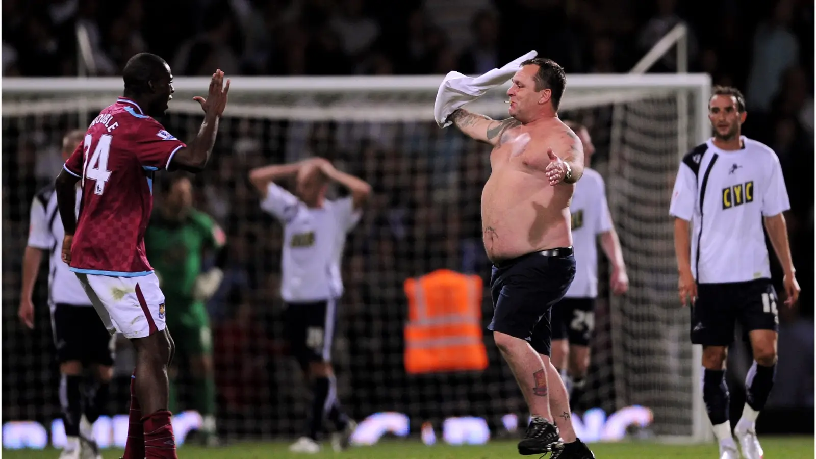 West Ham supporters invade the pitch during the 2009 League Cup match vs. Millwall.