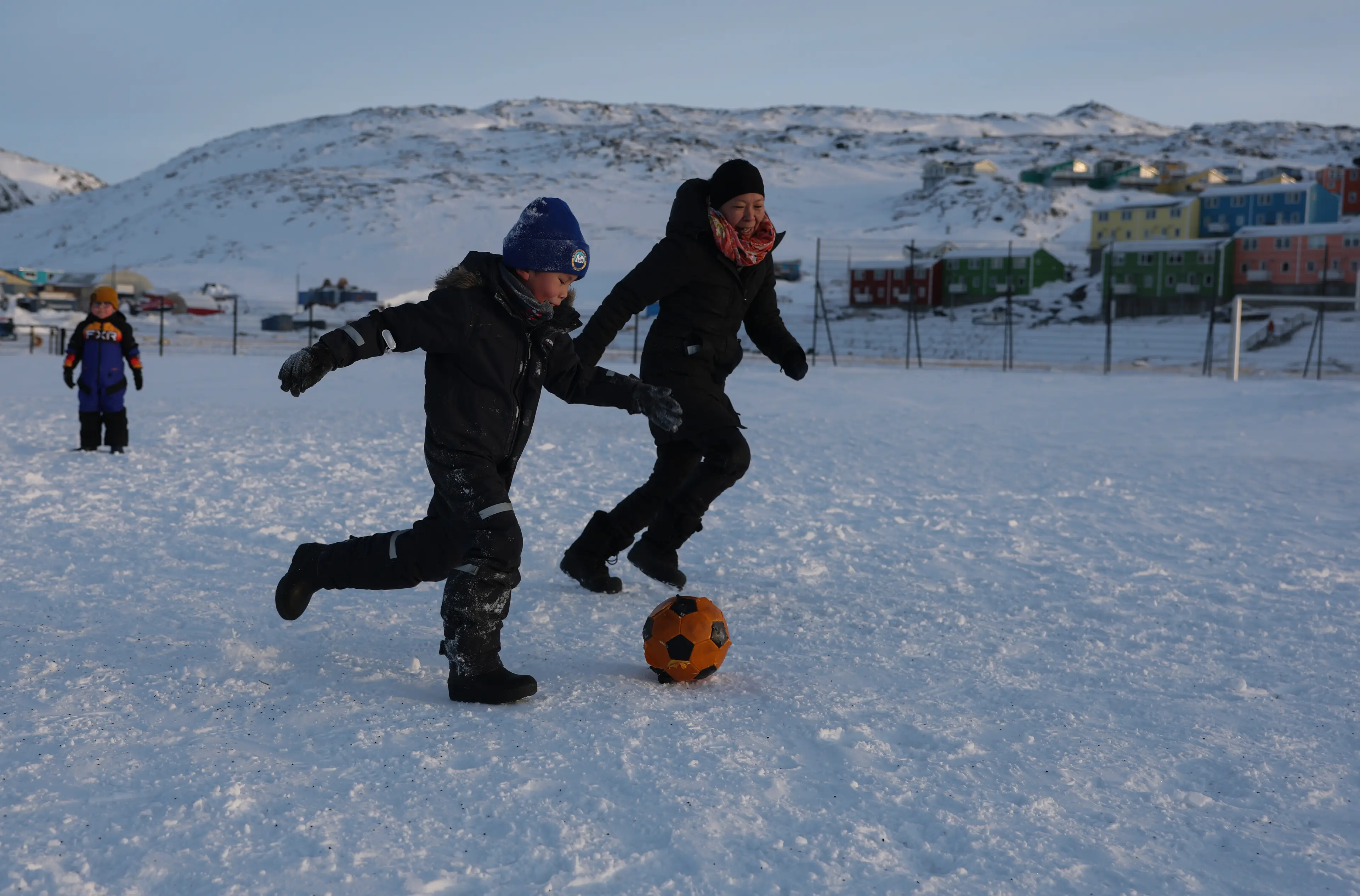 Members of the public play football in arctic conditions in Greenland. Image: Getty