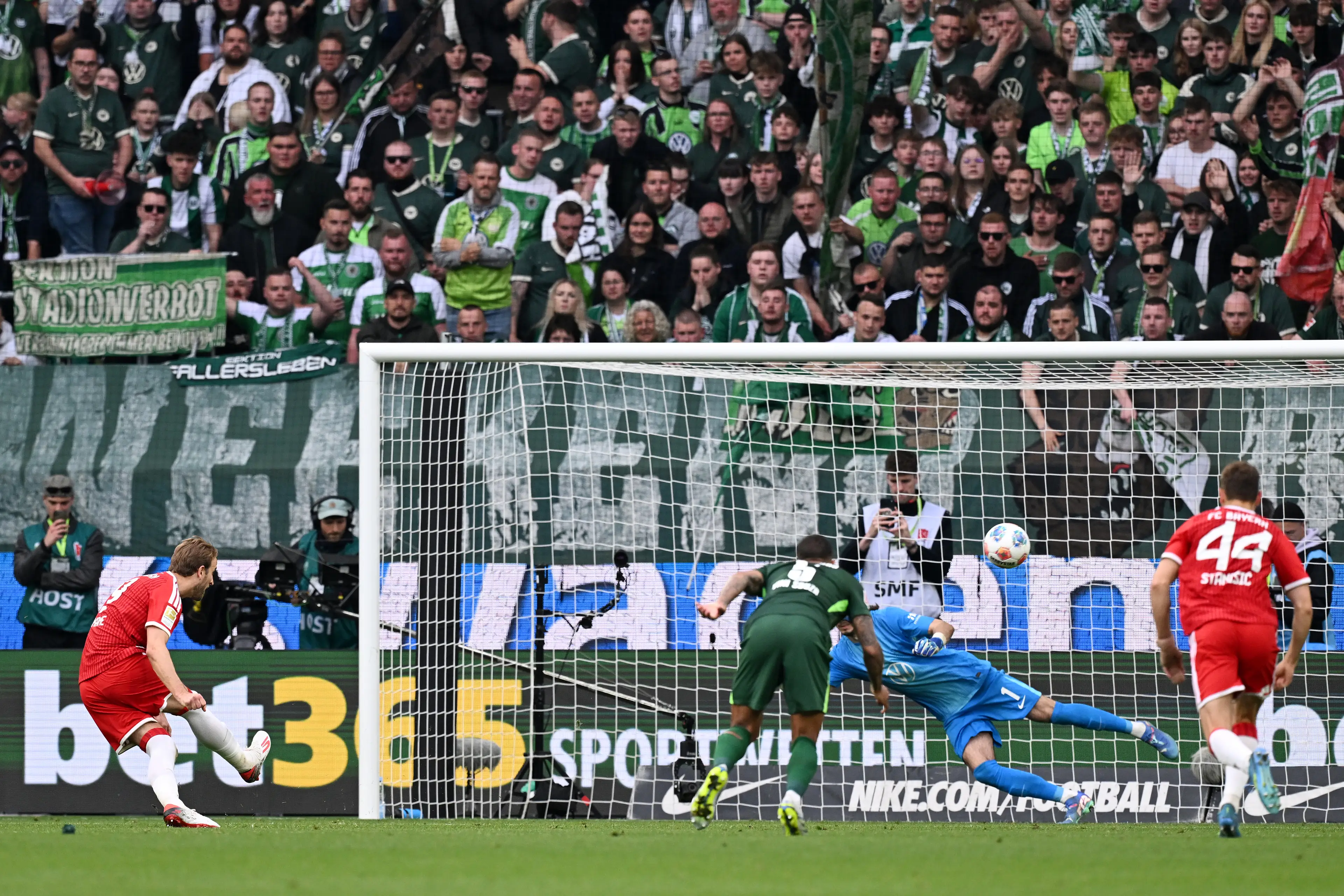 Harry Kane sends his penalty against Wolfsburg blazing wide. (