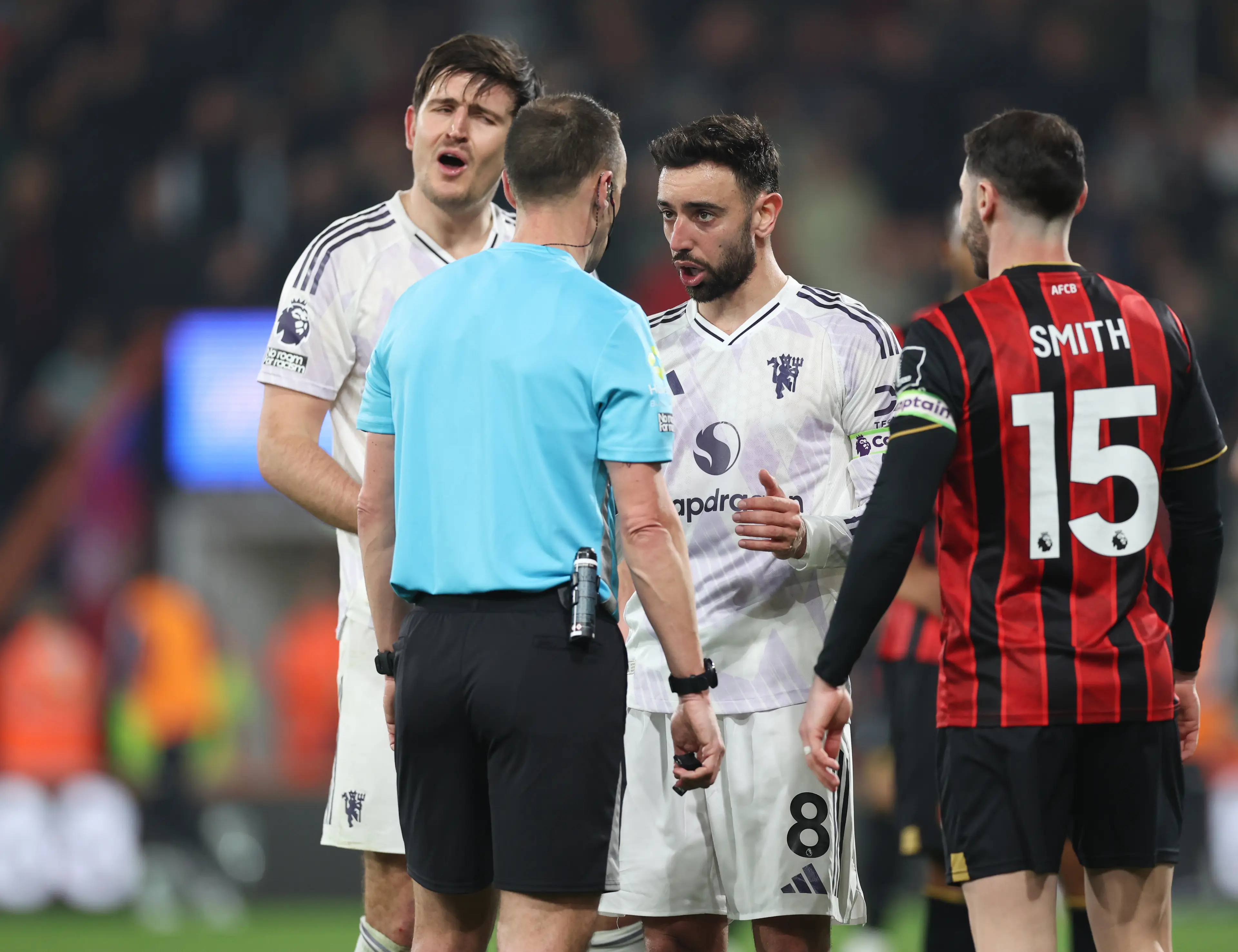 Harry Maguire and Bruno Fernandes appealing the decision (credit: getty) 