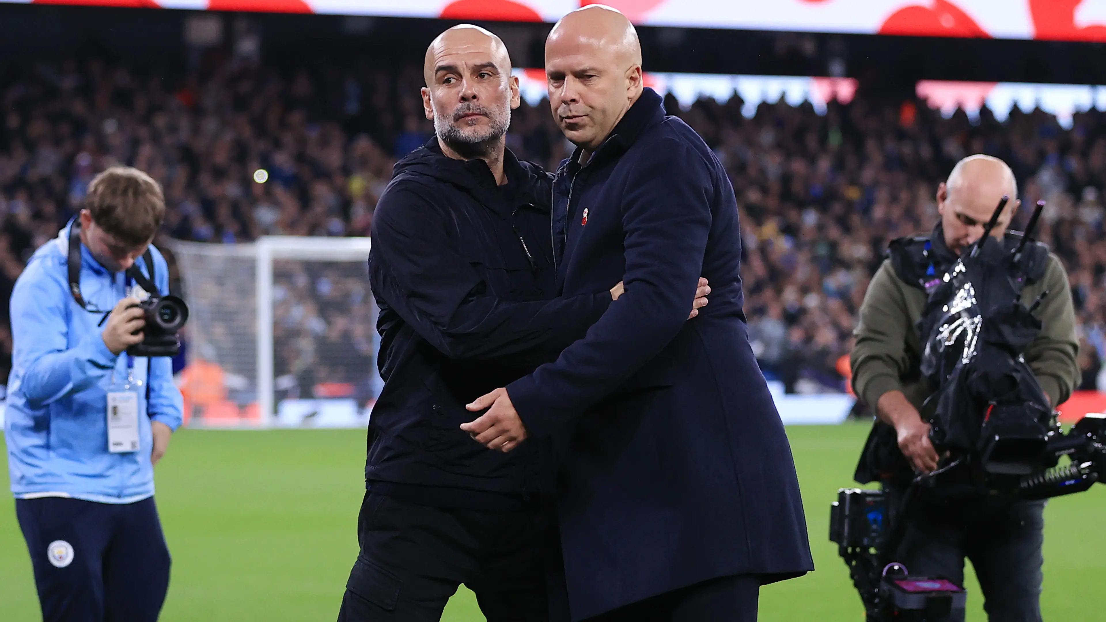 Pep Guardiola and Arne Slot (Getty)