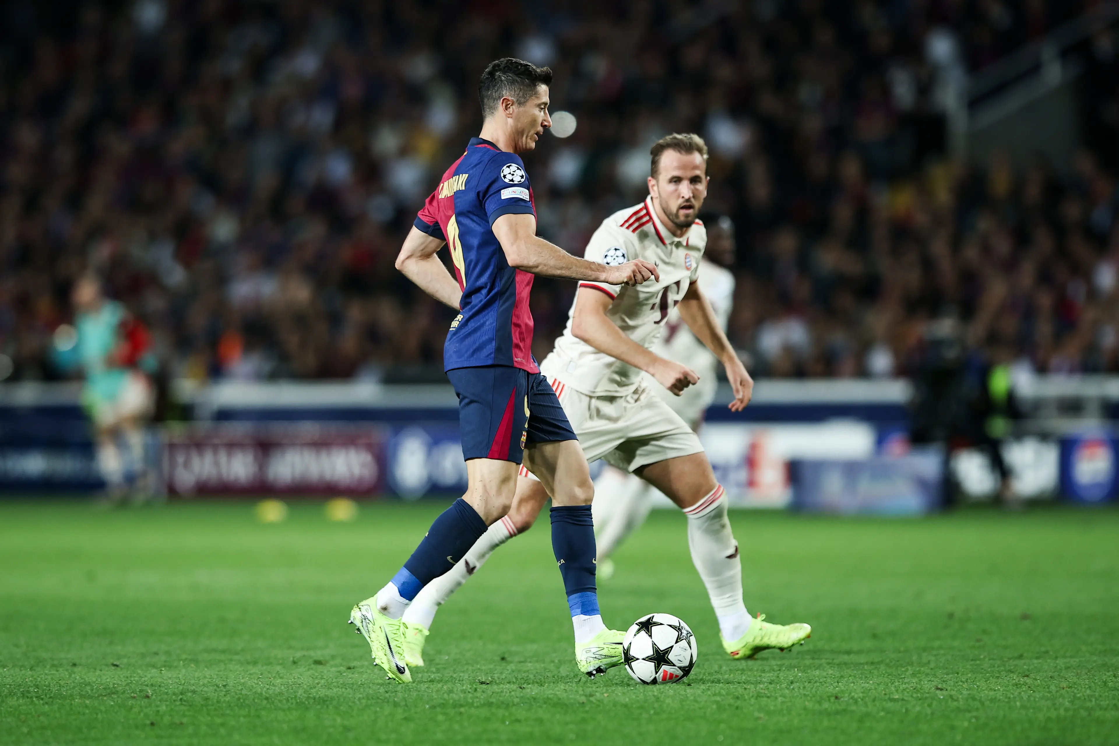 Harry Kane and Robert Lewandowski playing against each other in the Champions League. Image: Getty 