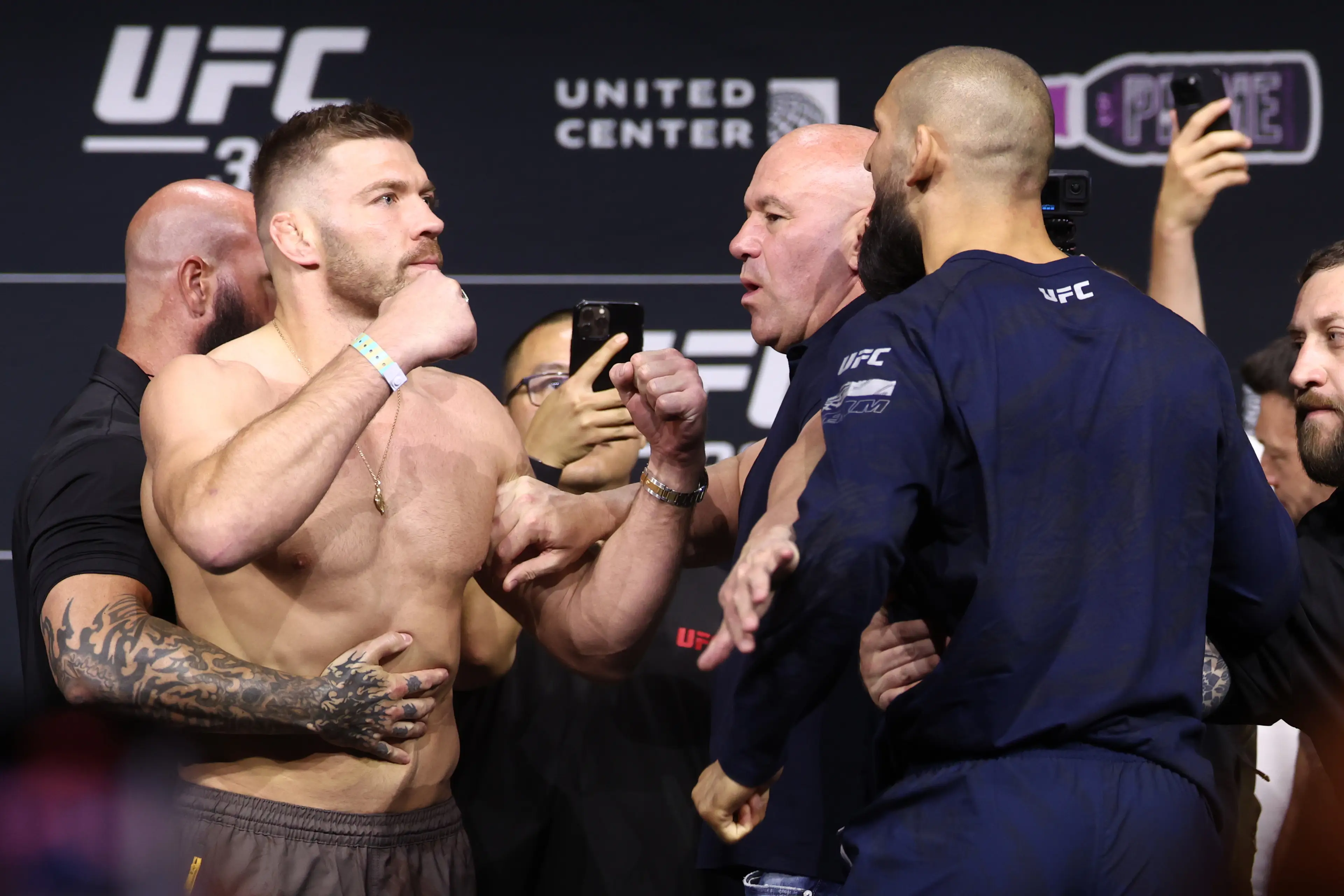 Khamzat Chimaev was pulled away from Dricus Du Plessis at the UFC 319 ceremonial weigh-ins. Image: Getty 