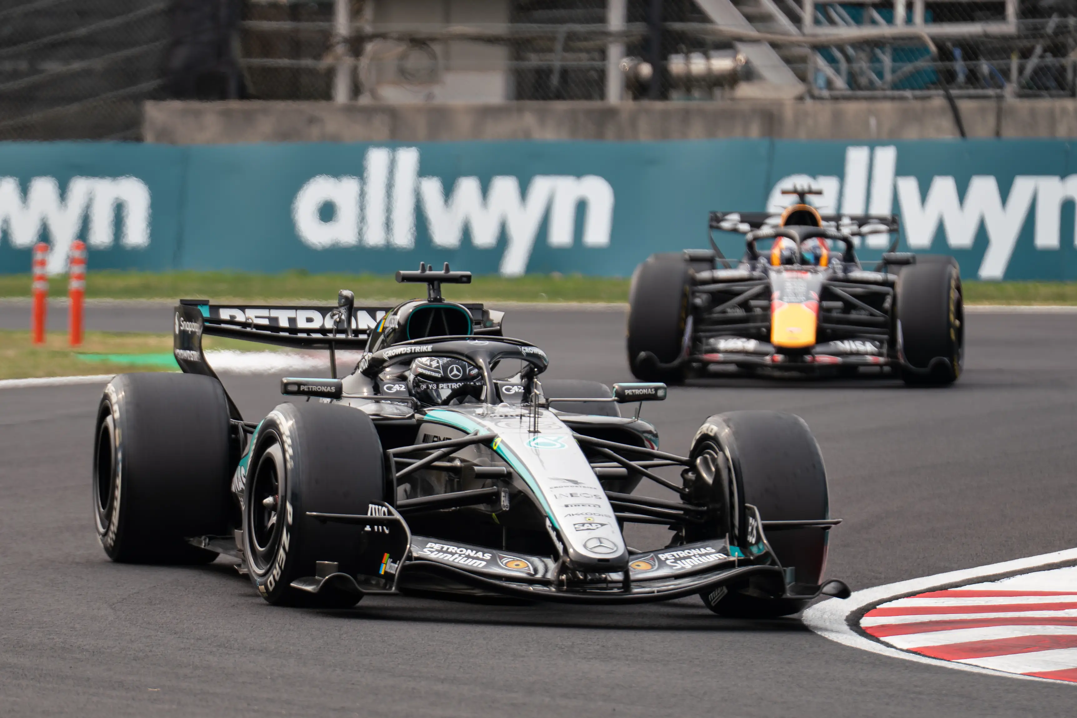 George Russell and Max Verstappen on track (credit: getty)