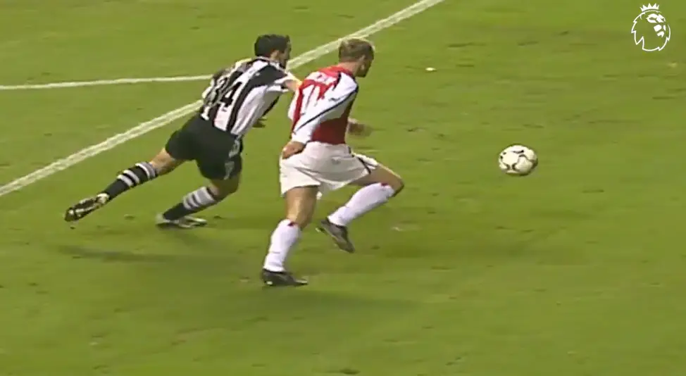 Bergkamp beats Dabizas to the ball. Image: Premier League