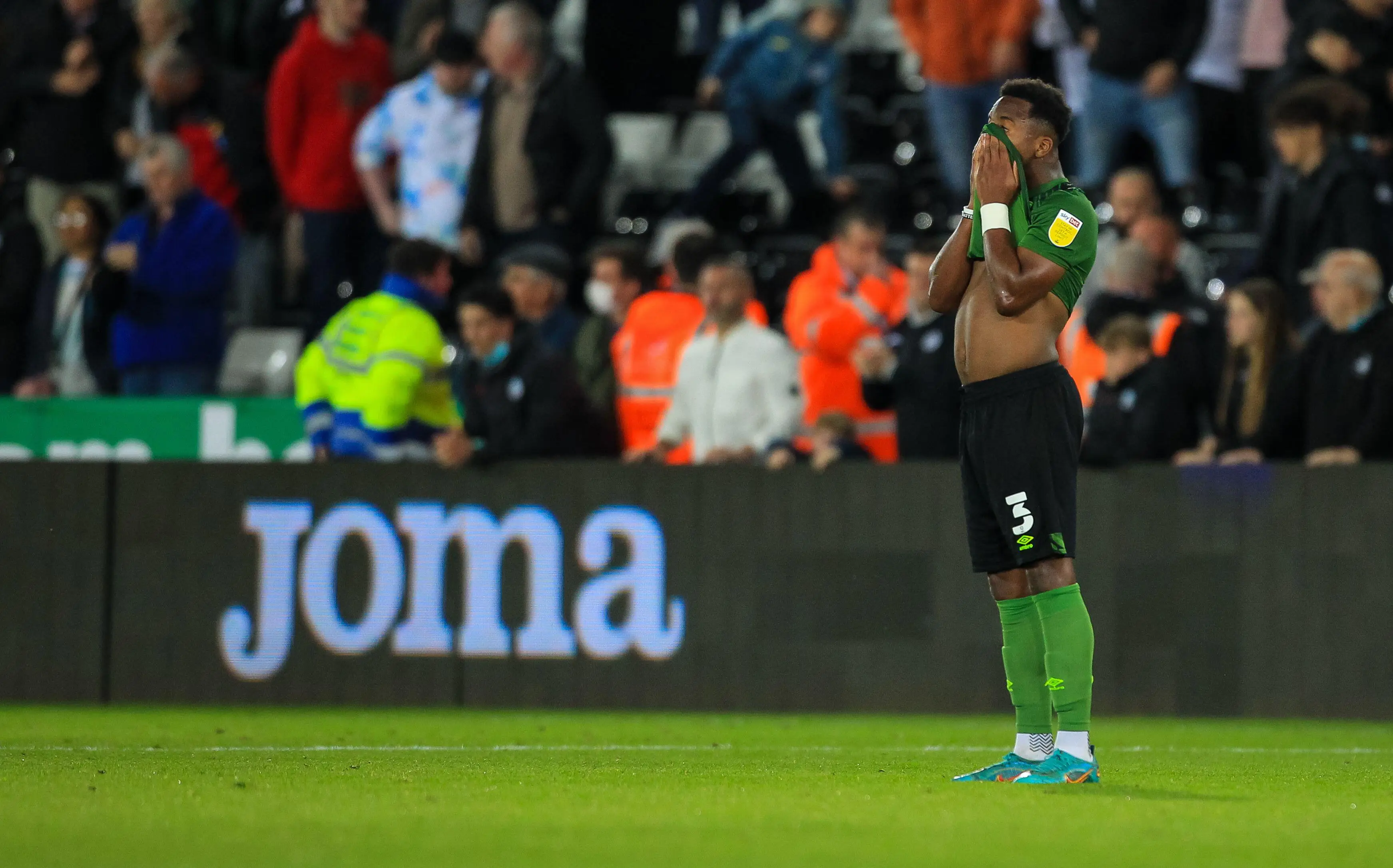 Ethan Laird in disappointment after AFC Bournemouth drew 3-3 against Swansea City |