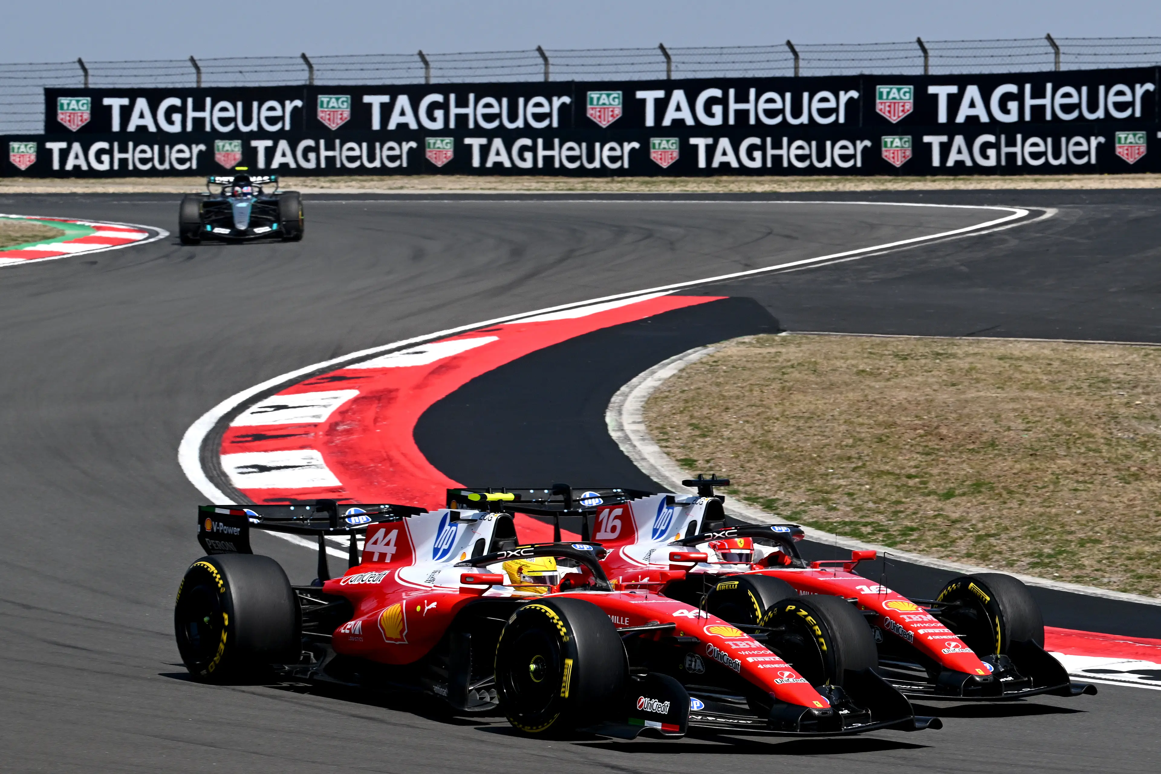 Lewis Hamilton and Charles Leclerc battling in China (credit: getty)