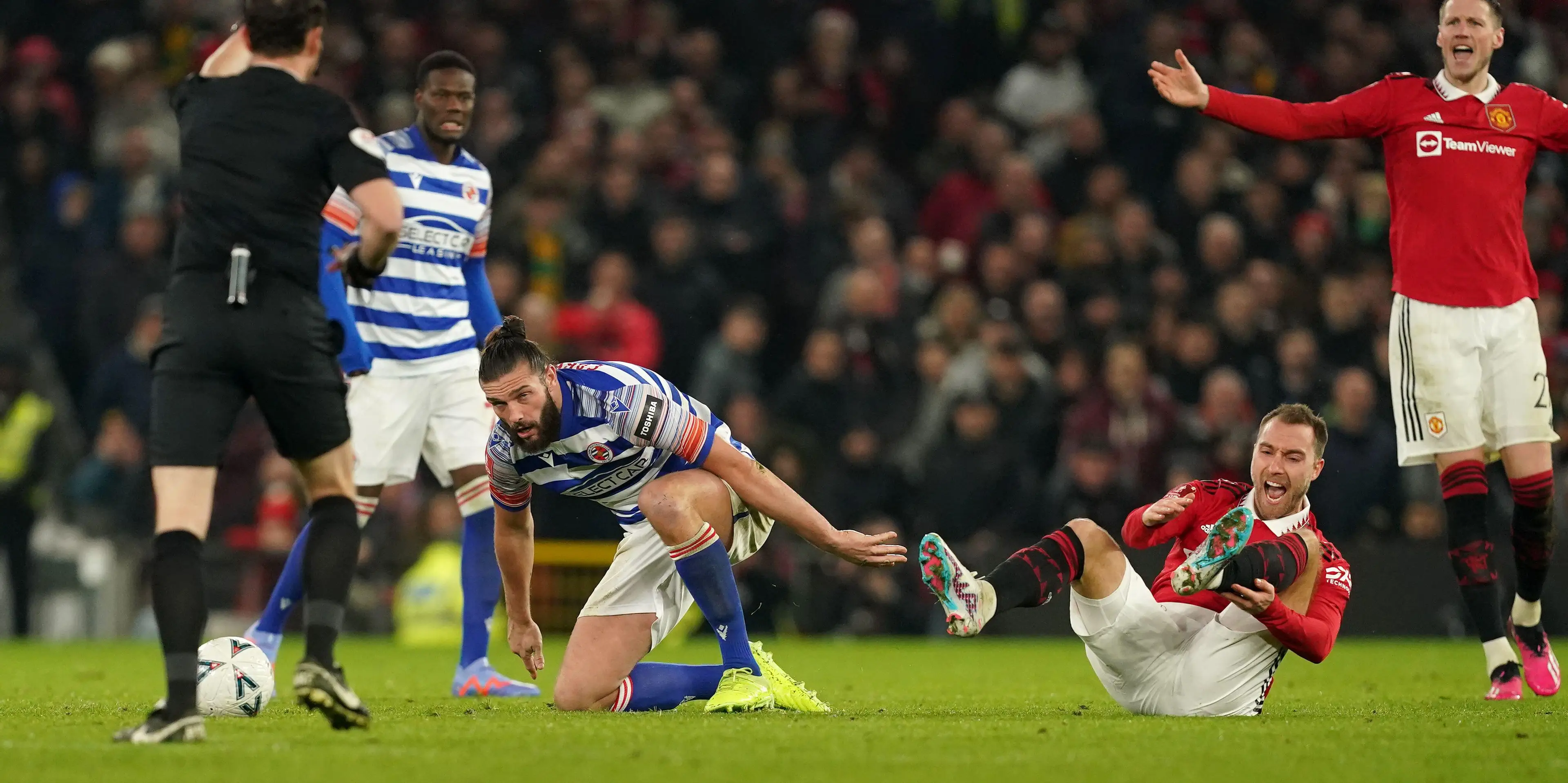 Christian Eriksen left in pain following Andy Carroll's tackle. Image: Alamy 