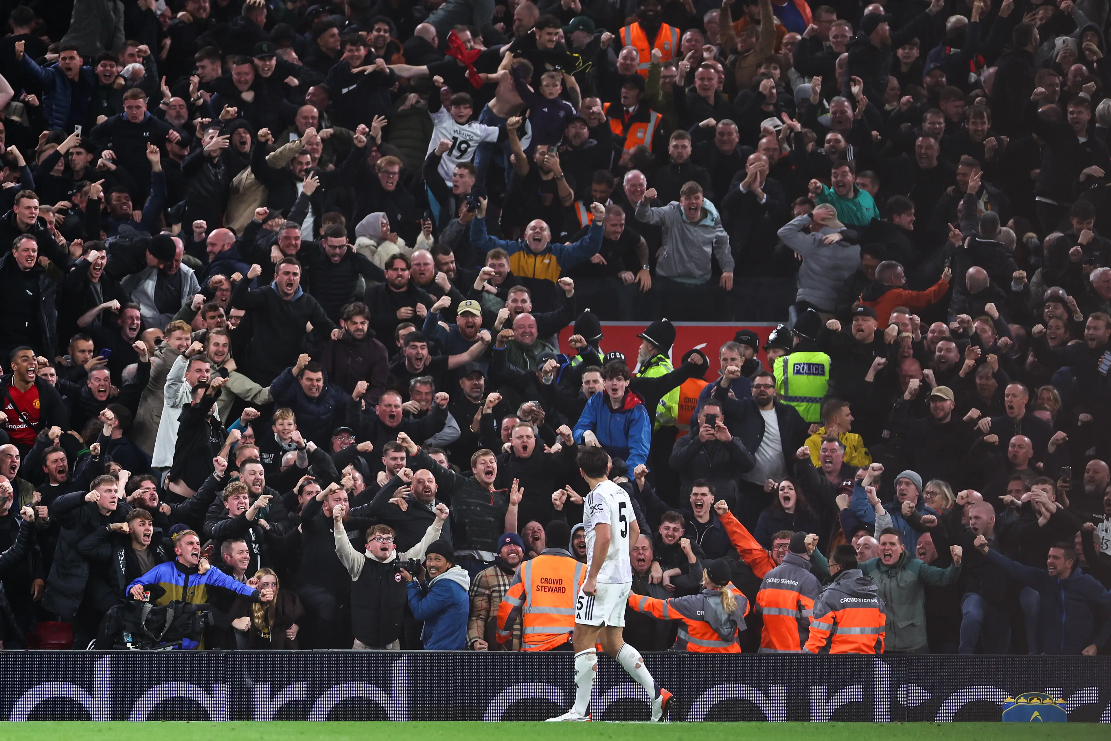 Maguire celebrating with the Man United supporters. (Image: Robbie Jay Barratt - AMA / Contributor via Getty)