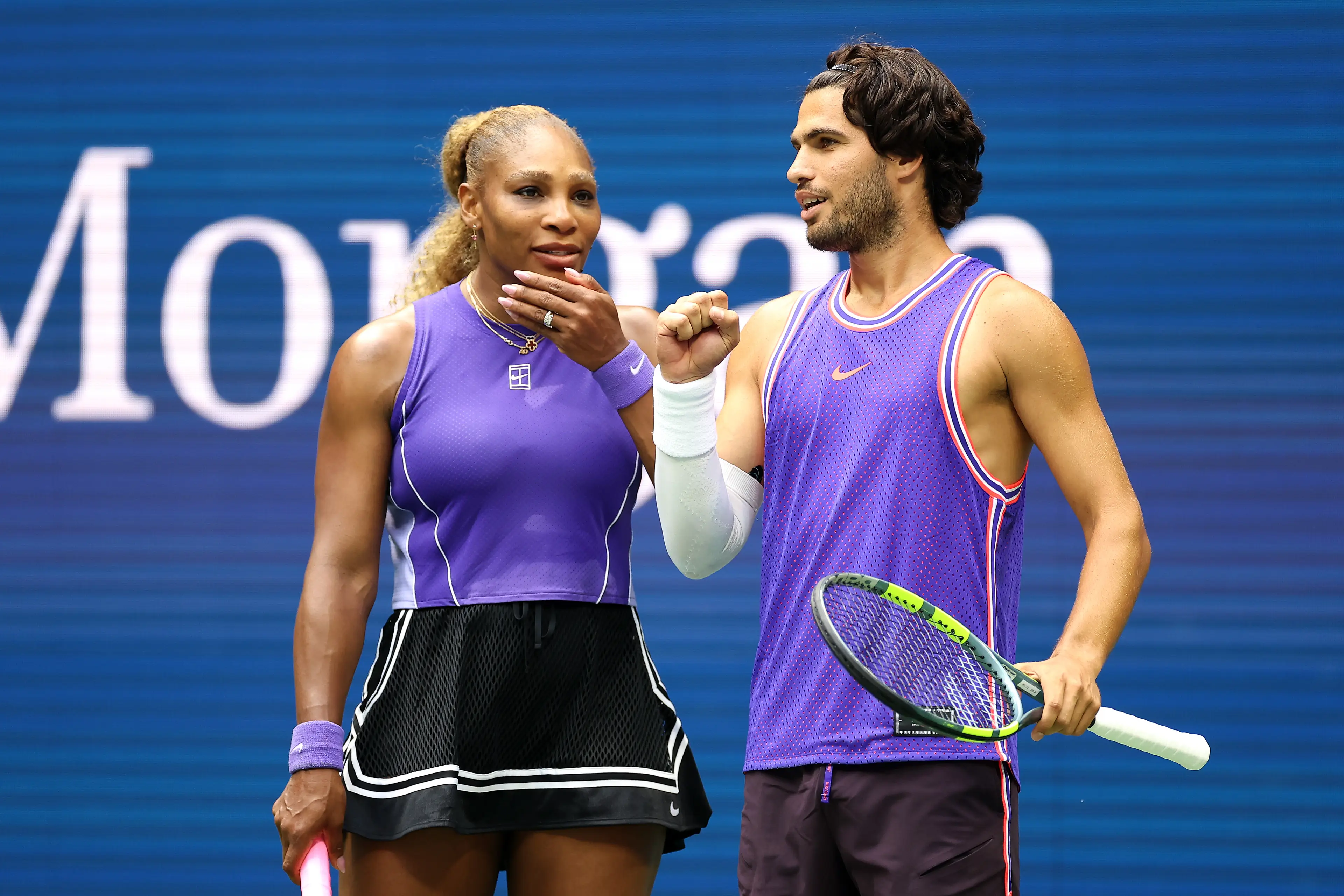 Carlos Alcaraz of Spain interacts with Serena Williams of the United States in their mixed doubles match against Erin Routliffe of New Zealand and Lloyd Glasspool of the United Kingdom, Getty Images