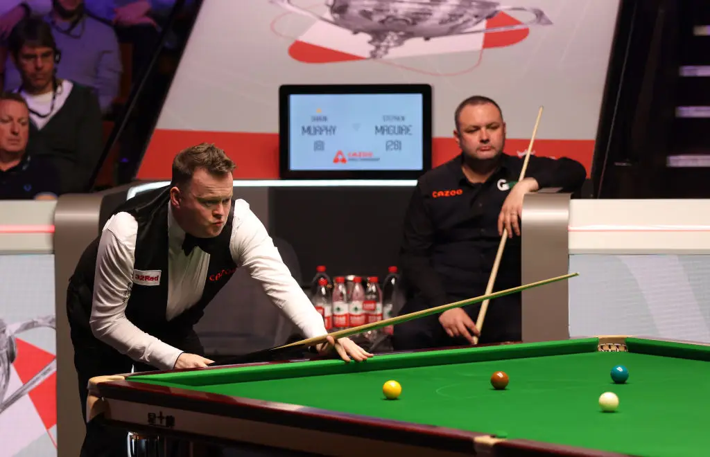 Shaun Murphy (at the table) and Stephen Maguire pictured in action at the 2024 World Snooker Championship (Image: Getty)