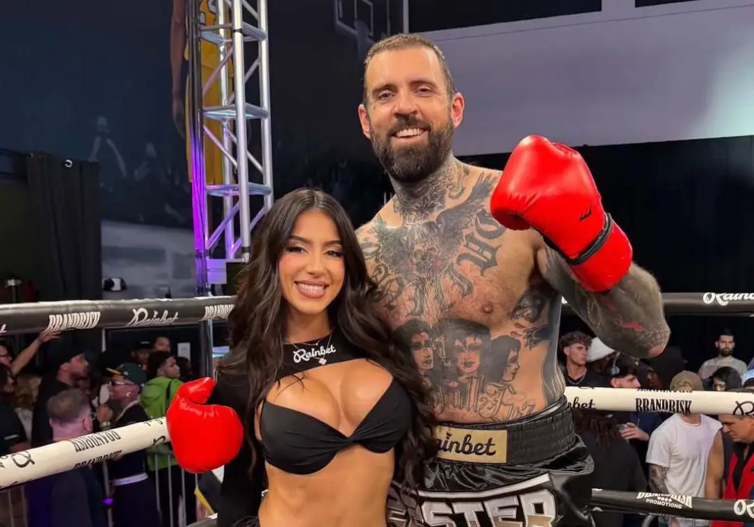 Adam's wife Lena The Plug was the ring girl for his boxing fight with Jason Luv. Image: Instagram/Adam22