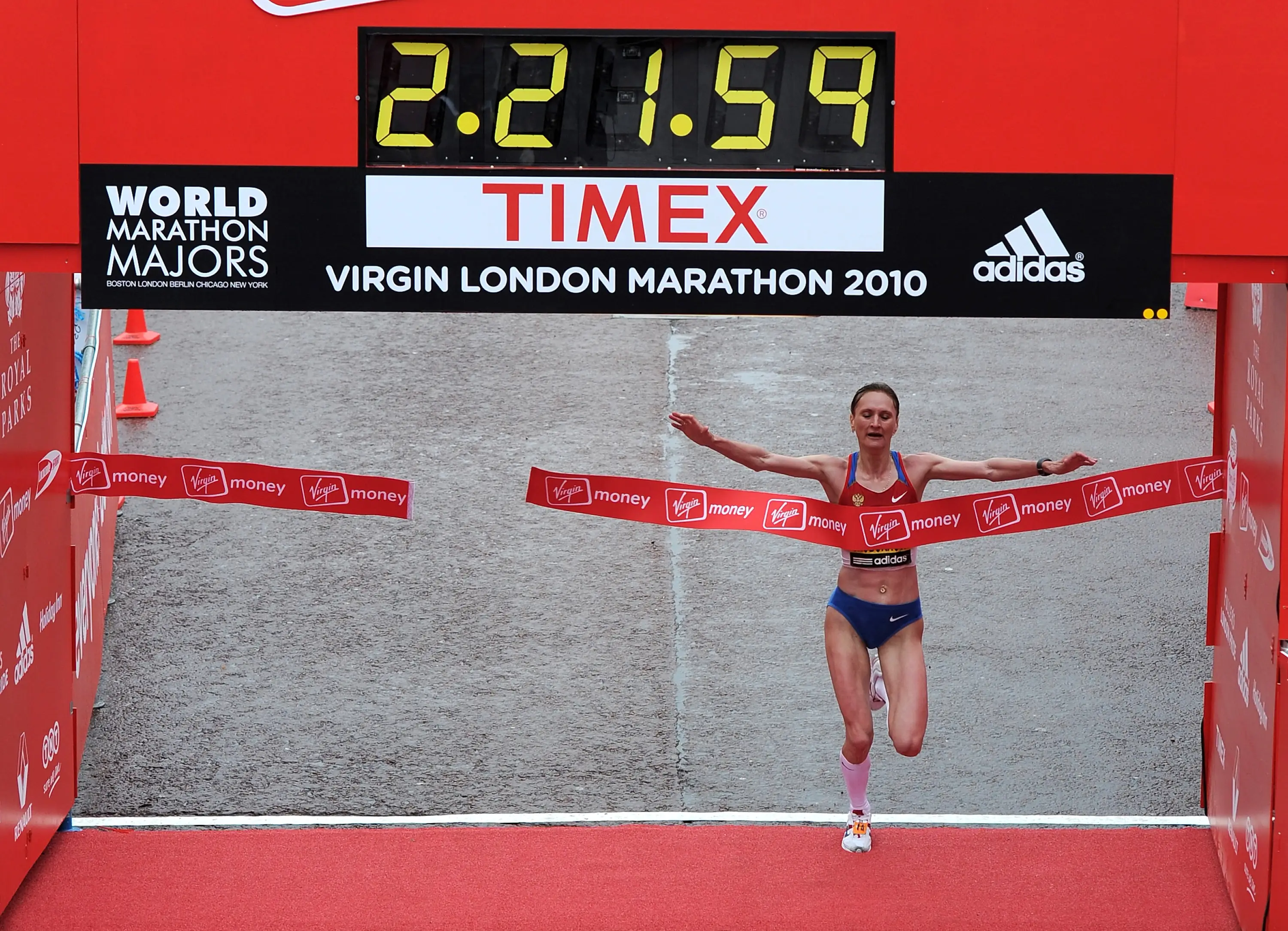 Liliya Shobukhova of Russia crosses the finish line to win the VLM Womens Elite section of the 2010 Virgin London Marathon on April 25, 2010 in London, England. (Getty Images)