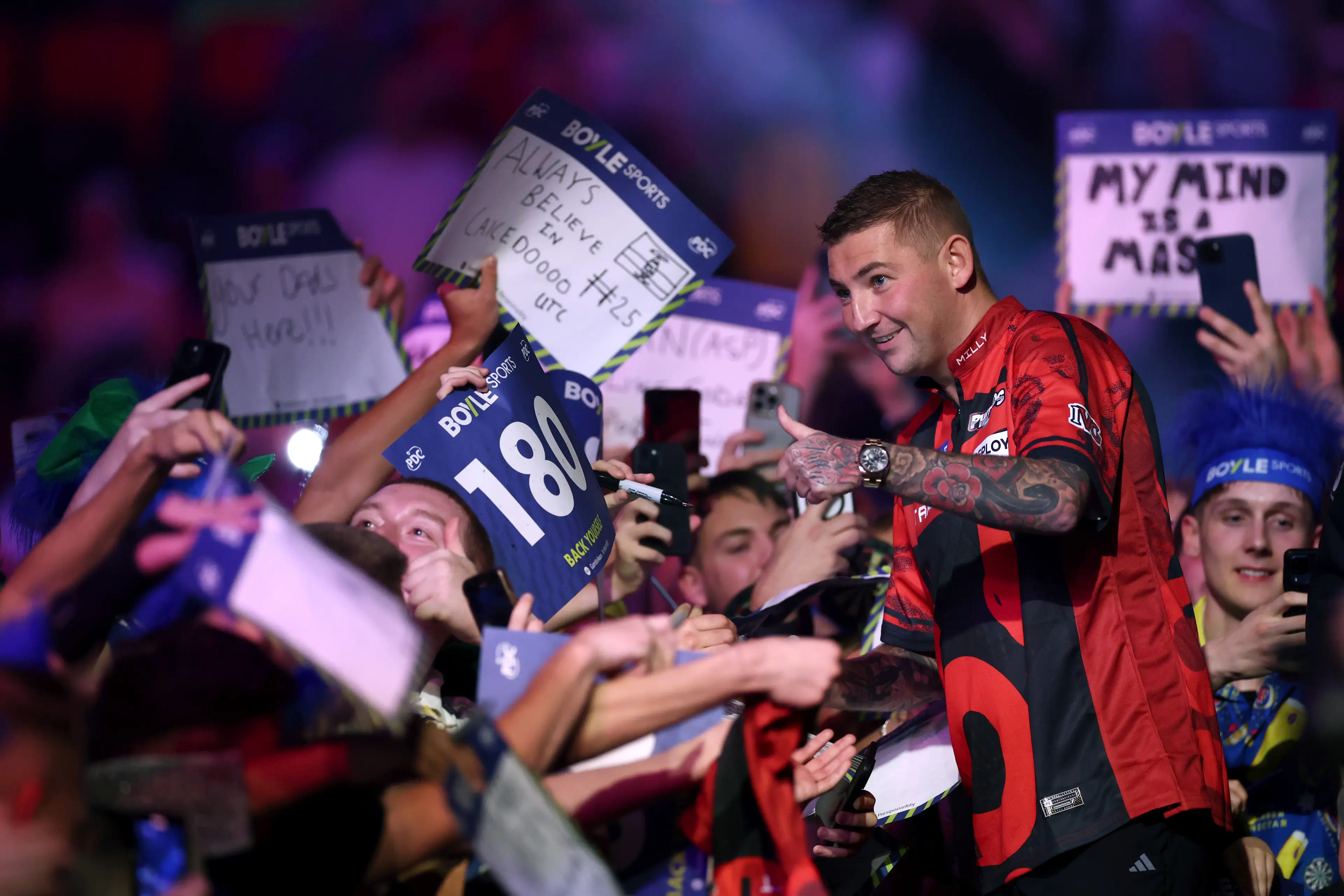 Nathan Aspinall fears he wouldn't get invited back if he changed his walk-on song. Image: Getty 