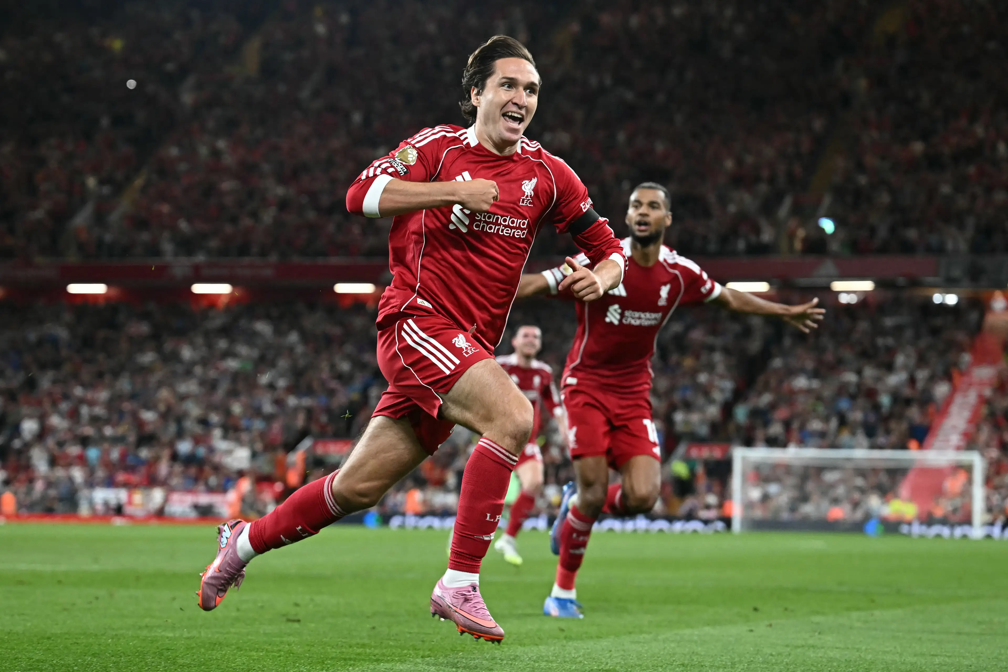 Federico Chiesa pointed at Liverpool's badge after finding the net. Image: Getty