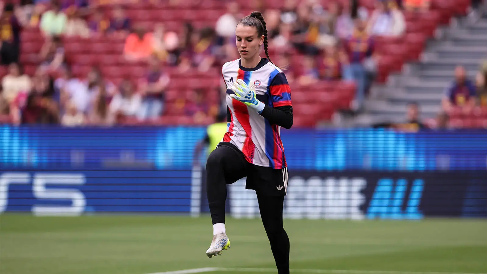 Mahmutovic warmed up in her Bayern training top but had to change before the match started (Image: Getty)