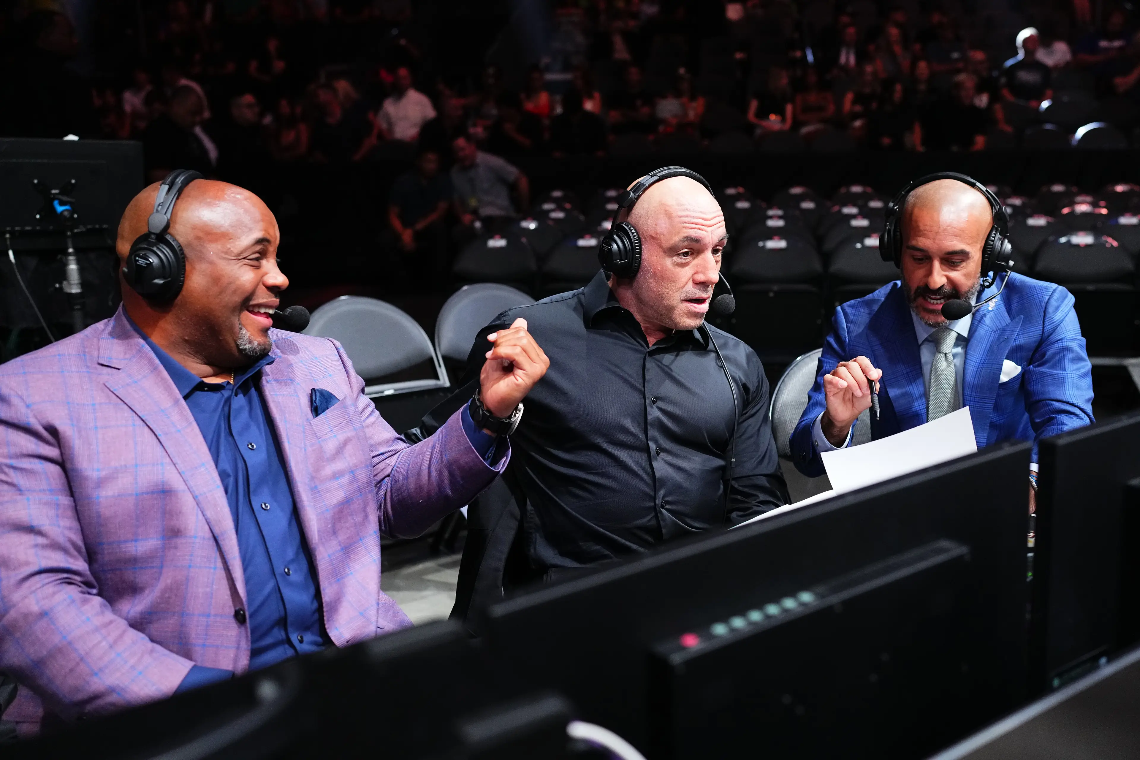Joe Rogan in the commentary booth for UFC 303. Image: Getty 